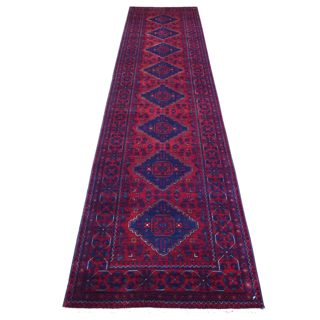 Rug 2'8"x12'6" Deep Red Hand Knotted Afghan Khamyab Pure Wool Runner: Rug 2'8"x12'6" Deep Red Hand Knotted Afghan Khamyab Pure Wool Runner Experience the rich warmth and beauty of traditional Afghan craftsmanship with this stunning 100% pure wool runner, hand-knotted in