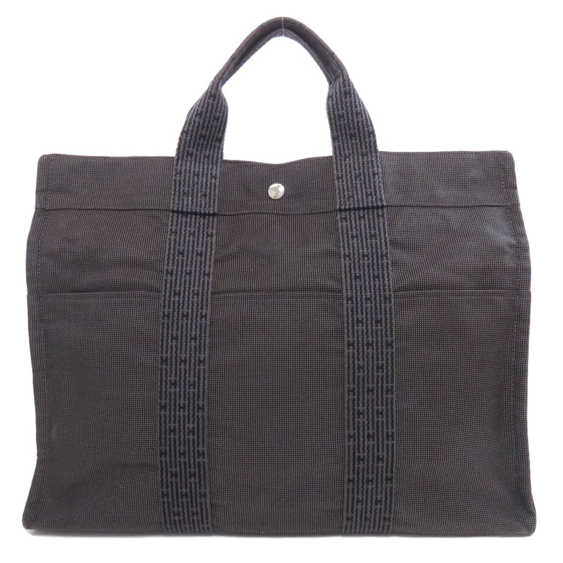 Canvas HERMES Her LineMM Tote Bag: Canvas HERMES Her LineMM Tote Bag Experience the timeless elegance of the HERMES Her Line MM Tote Bag, crafted from rich black canvas and exuding classic French sophistication. This iconic tote is a m