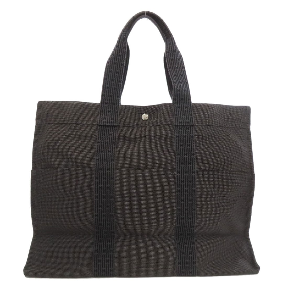 Canvas HERMES Her LineGM Tote Bag: Canvas HERMES Her LineGM Tote Bag Experience the timeless elegance of Herm?s with this stunning canvas tote bag, crafted in the iconic French style that exudes sophistication and refinement. The soft