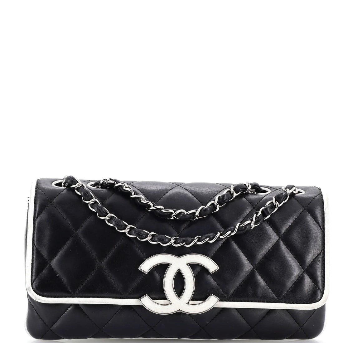 Chanel Divine Flap Bag in Medium Quilted Lambskin: Chanel Divine Flap Bag in Medium Quilted Lambskin A timeless and sophisticated Chanel Divine Flap Bag in medium quilted lambskin, boasting sleek black exterior with subtle white accents, sits atop a