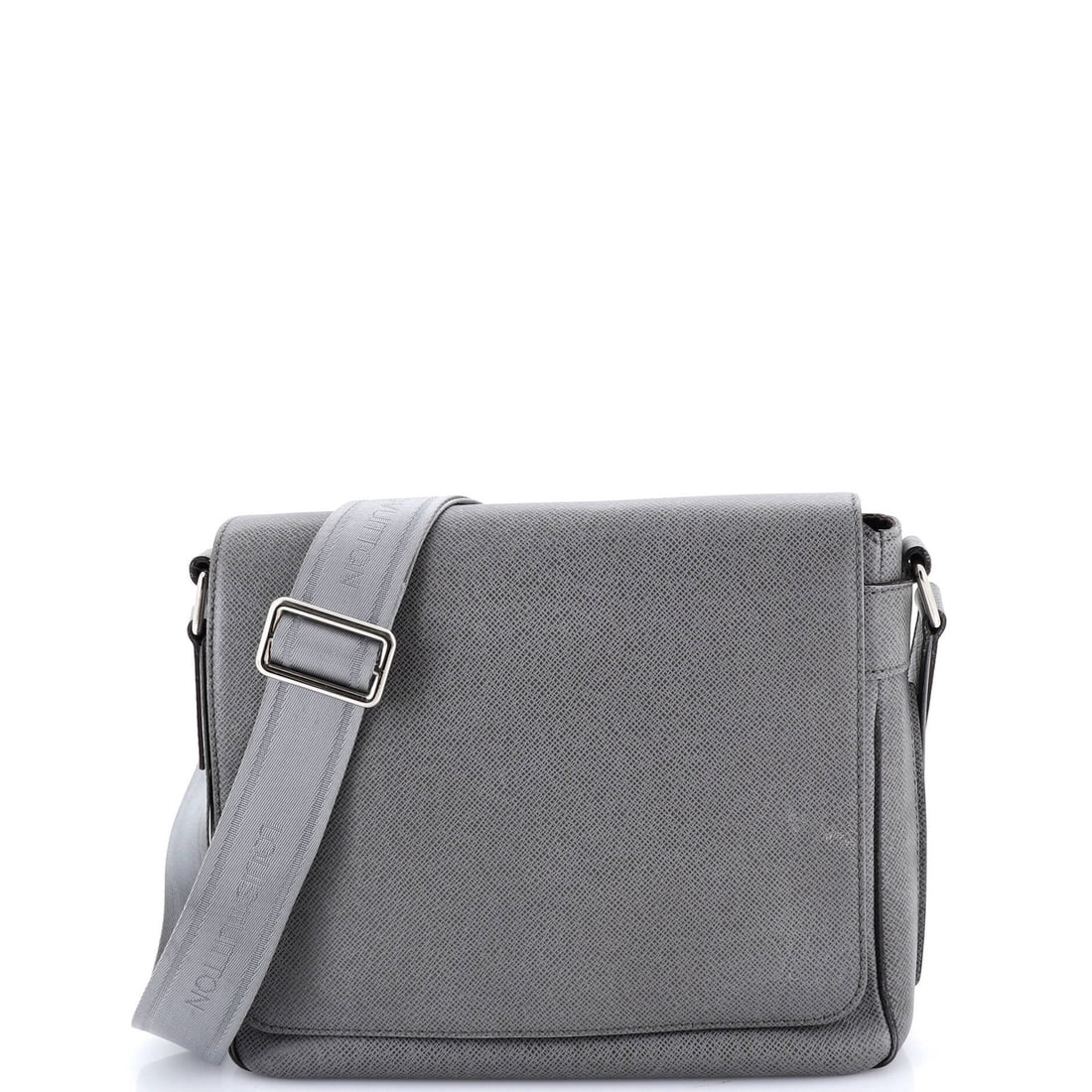 Louis Vuitton Roman Handbag in Taiga Leather: Louis Vuitton Roman Handbag in Taiga Leather The Louis Vuitton Roman Handbag in Taiga Leather is a timeless classic, boasting a sleek gray exterior and rich brown interior. With its signature monogram