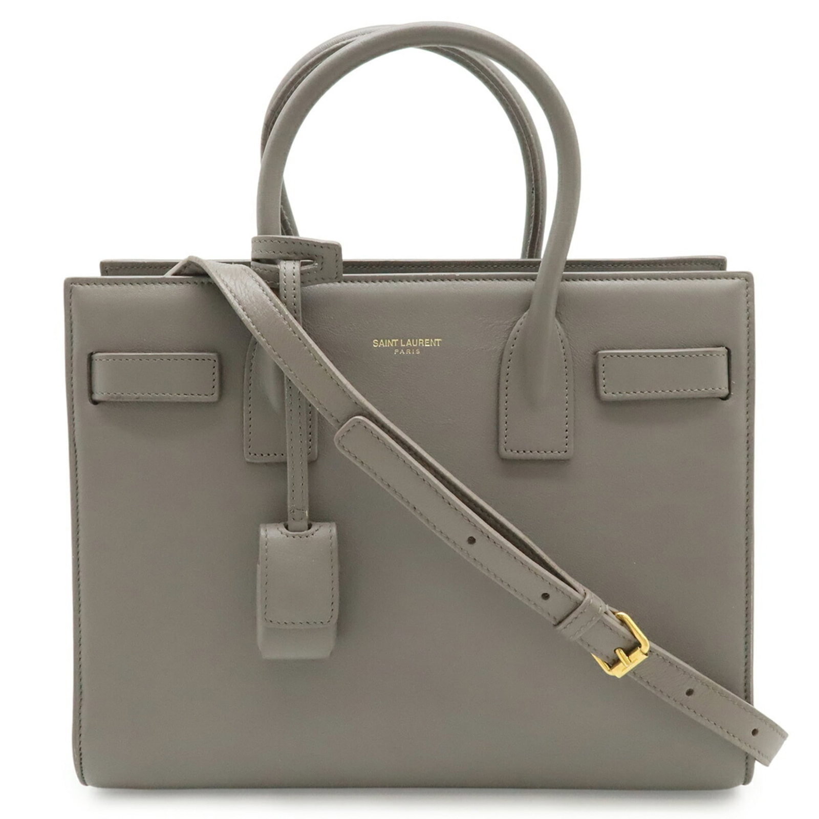 Yves Saint Laurent Shoulder Bag in Leather: Yves Saint Laurent Shoulder Bag in Leather A timeless piece from the iconic Yves Saint Laurent collection, this sleek shoulder bag is crafted from rich gray leather and boasts clean lines that exude e