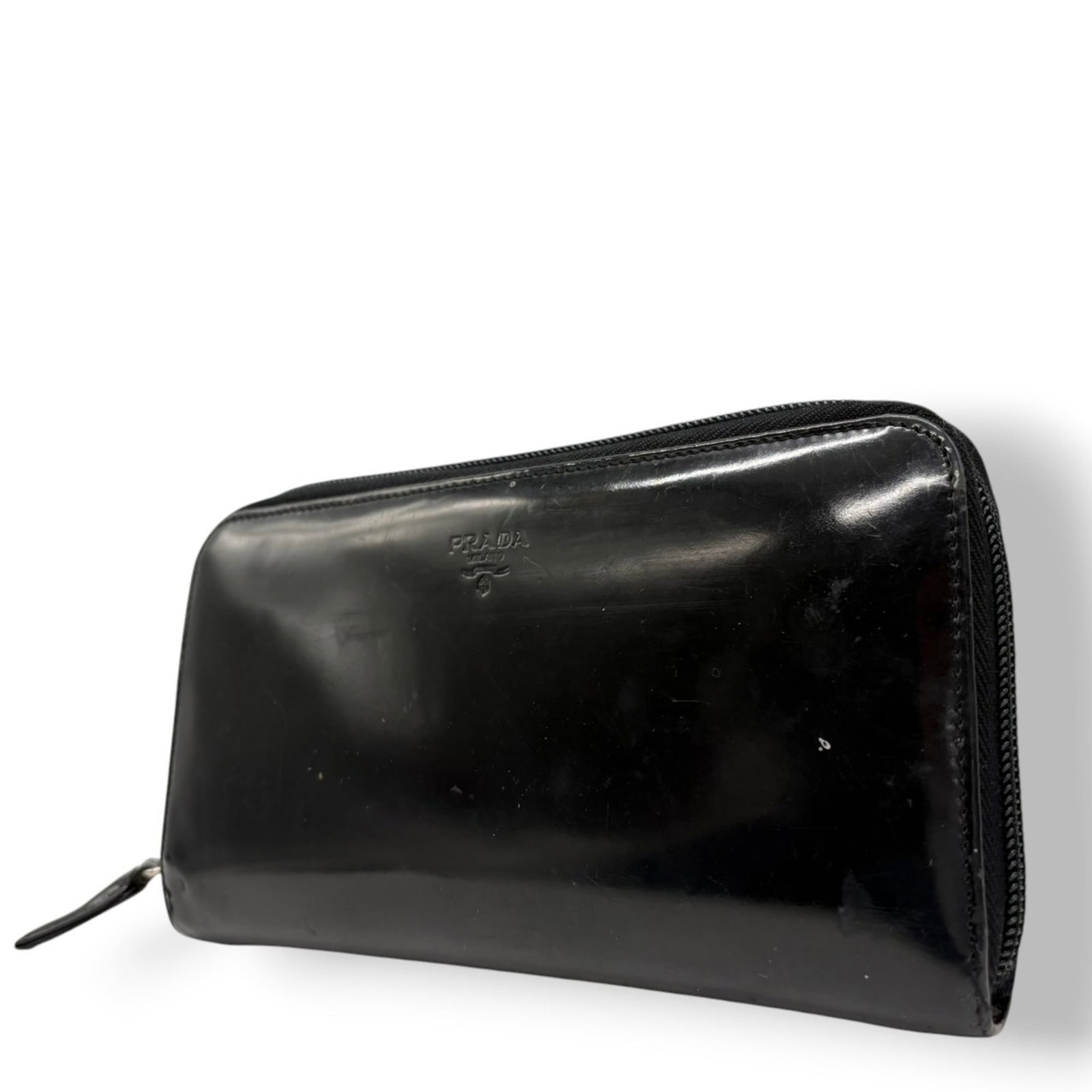 Leather Prada Long Wallet (Bi-Fold) Patent: Leather Prada Long Wallet (Bi-Fold) Patent A luxurious Prada long wallet in patent leather, boasting a sleek bi-fold design that adds sophistication to any outfit. With its classic black color and sub