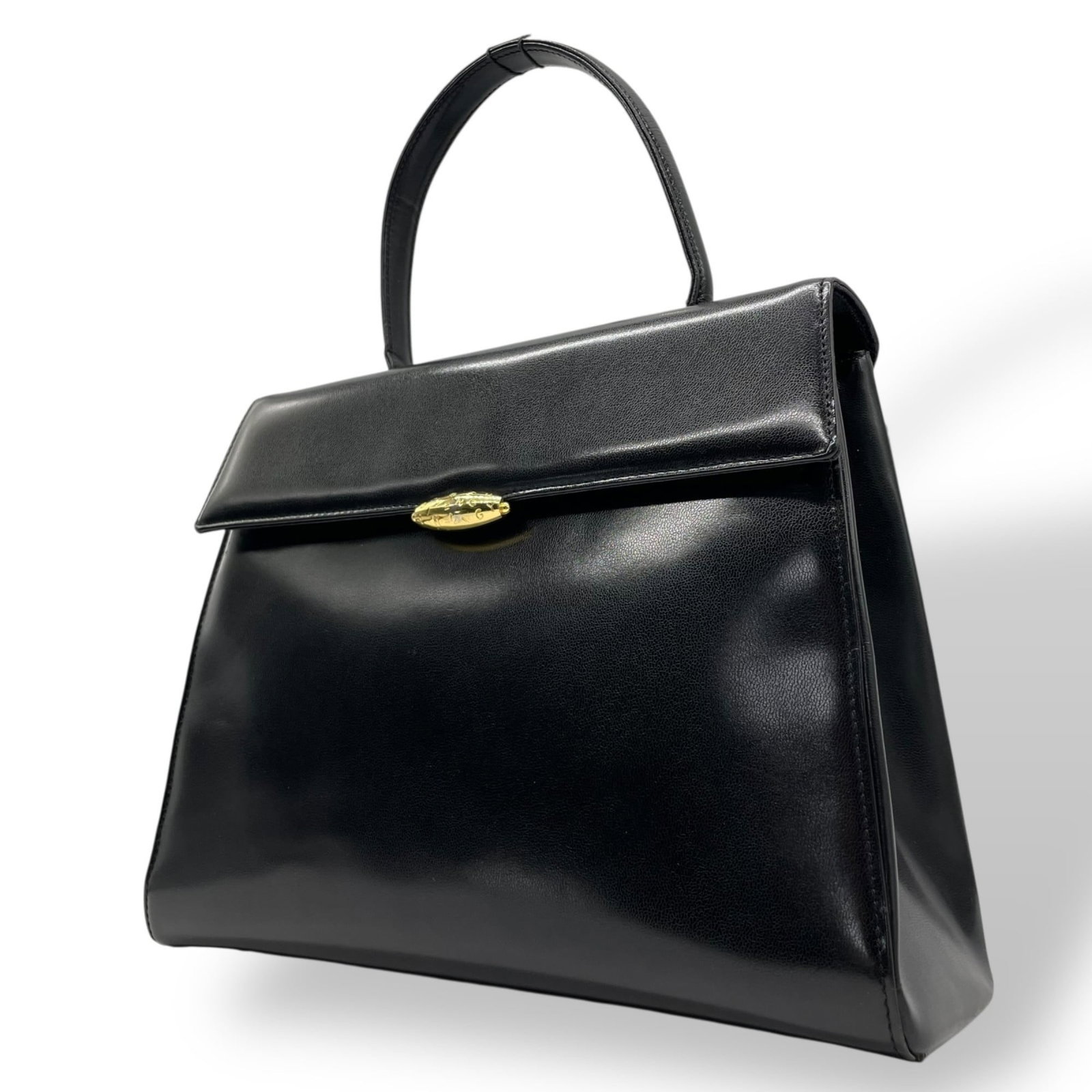 Givenchy Leather Handbag: Givenchy Leather Handbag A sleek and sophisticated black leather handbag from the iconic French fashion house Givenchy, boasting a classic design with clean lines and a timeless silhouette. With its s
