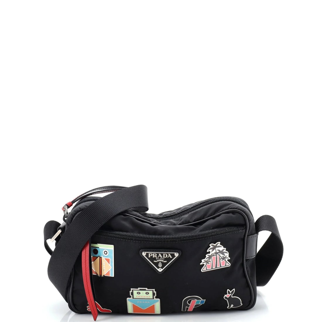 Prada Small Tessuto Pin Embellished Vela Shoulder Bag: Prada Small Tessuto Pin Embellished Vela Shoulder Bag Elevate your style with the Prada Small Tessuto Pin Embellished Vela Shoulder Bag, boasting sleek black nylon exterior and interior, adorned with