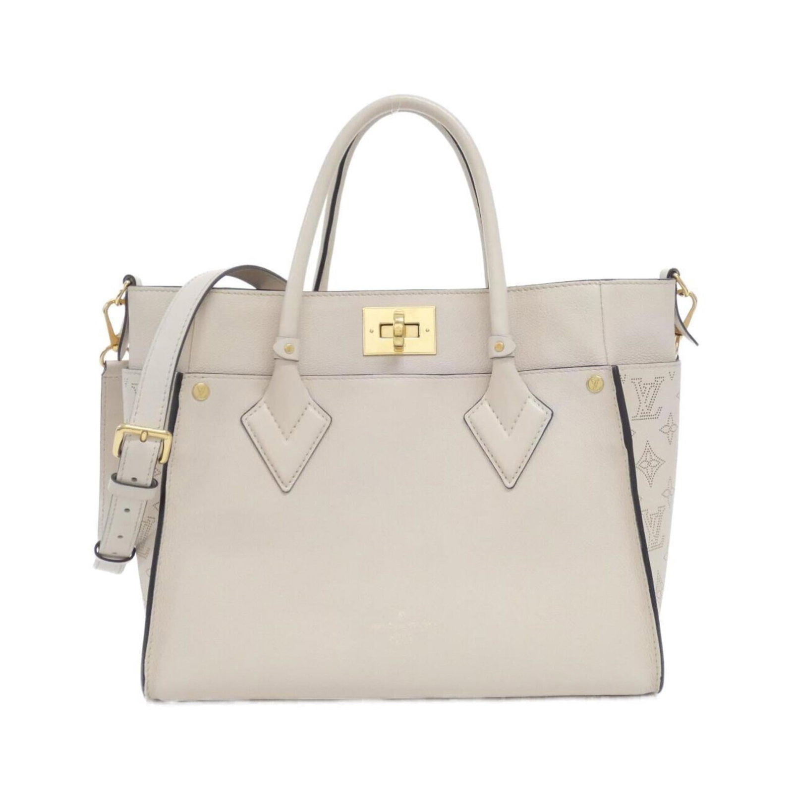 Louis Vuitton Leather Handbag: Louis Vuitton Leather Handbag A timeless piece of luxury, this Louis Vuitton leather handbag boasts classic grayish tones and gold hardware, exuding understated sophistication. Crafted from