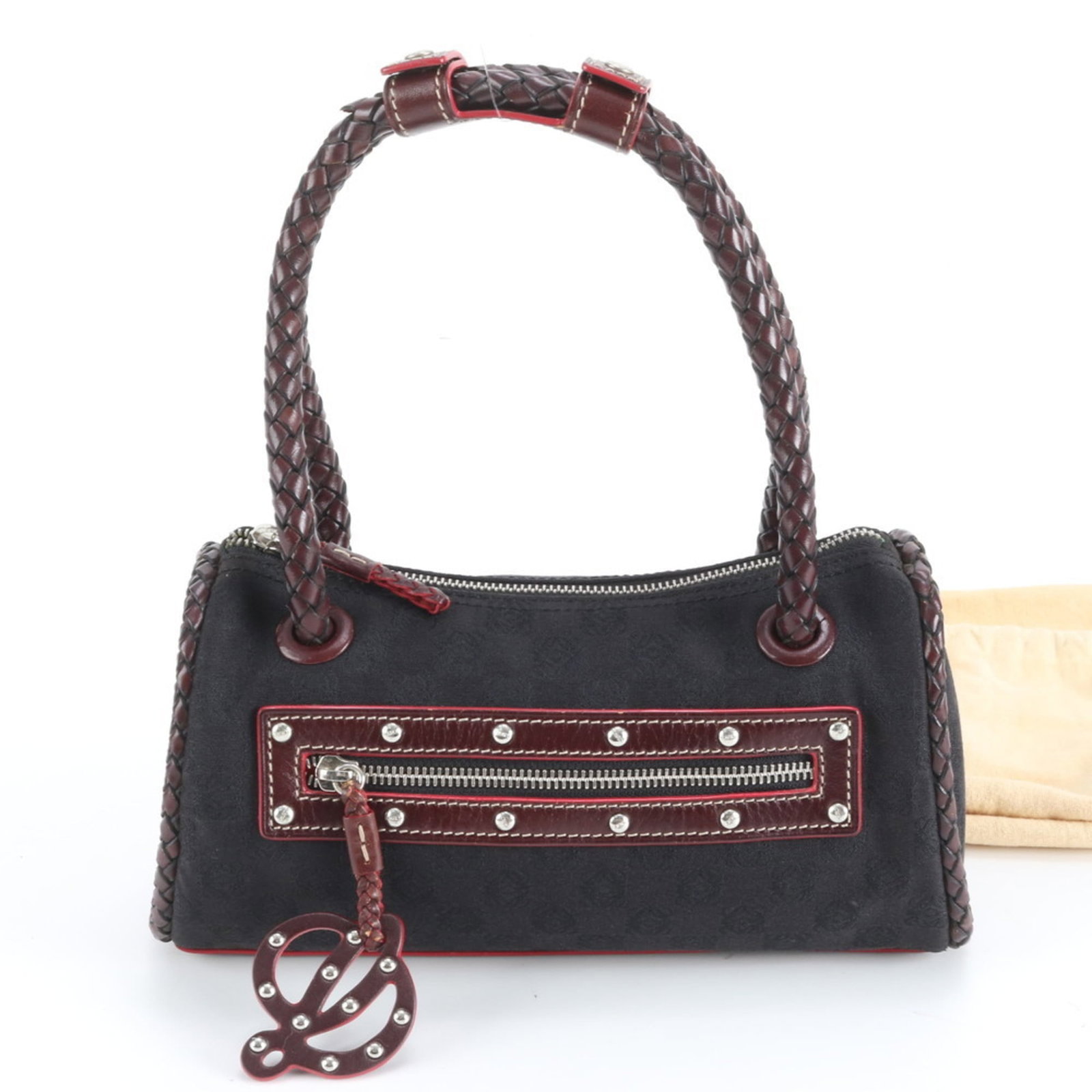 Loewe Tote Bag in Leather and Canvas: Loewe Tote Bag in Leather and Canvas A timeless and versatile Loewe tote bag, crafted from rich leather and durable canvas, boasts a sleek black finish that exudes sophistication. With its classic des