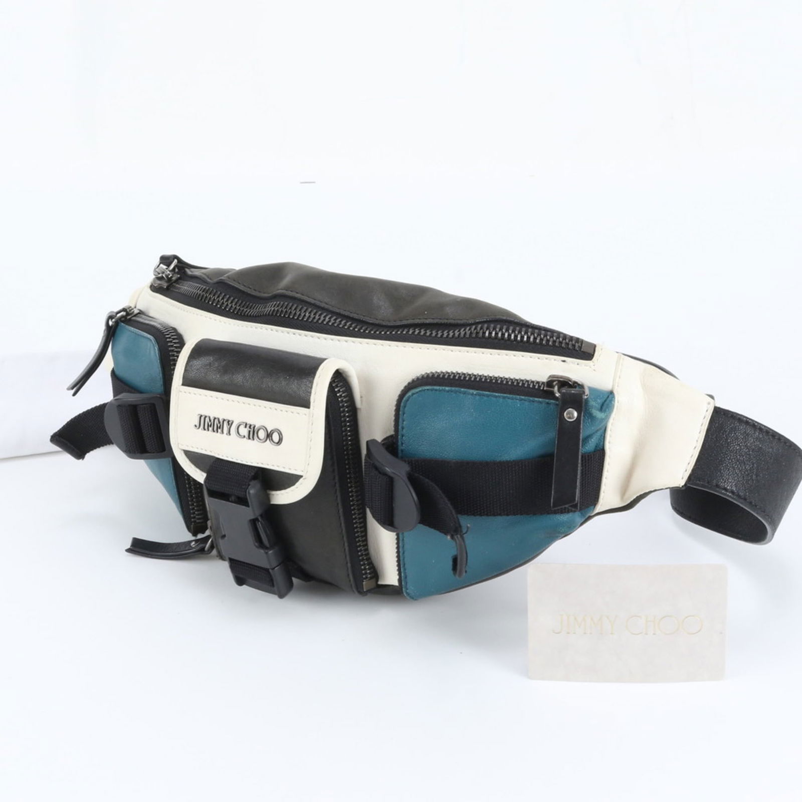 Jimmy Choo Leather Sling Bag Fanny Pack: Jimmy Choo Leather Sling Bag Fanny Pack Elevate your everyday style with the iconic Jimmy Choo Leather Sling Bag Fanny Pack, crafted from premium leather in sleek black, green, or white hues. This ver