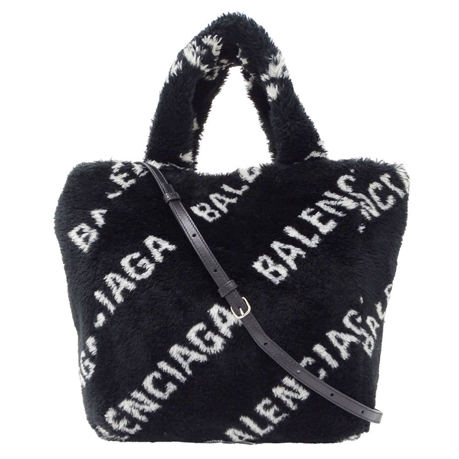 Balenciaga Shoulder Bag in Faux Fur: Balenciaga Shoulder Bag in Faux Fur Elevate your style with this luxurious Balenciaga shoulder bag, crafted from rich faux fur in sleek black. Its spacious interior and comfortable shoulder strap make
