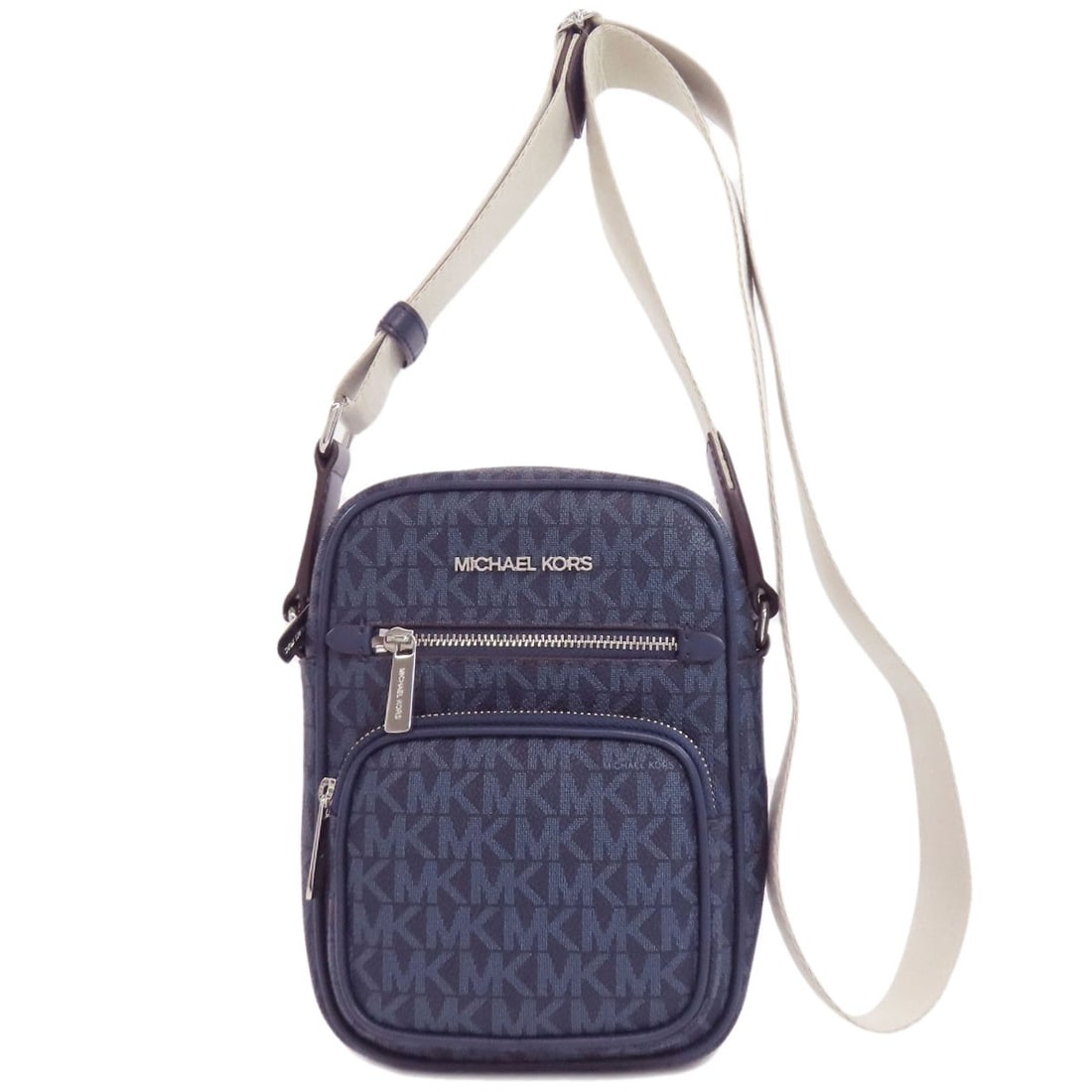 Michael Kors MK Signature Shoulder Bag in PVC: Michael Kors MK Signature Shoulder Bag in PVC The Michael Kors MK Signature Shoulder Bag in PVC is a chic and modern accessory that exudes sophistication with its sleek navy exterior made from durable