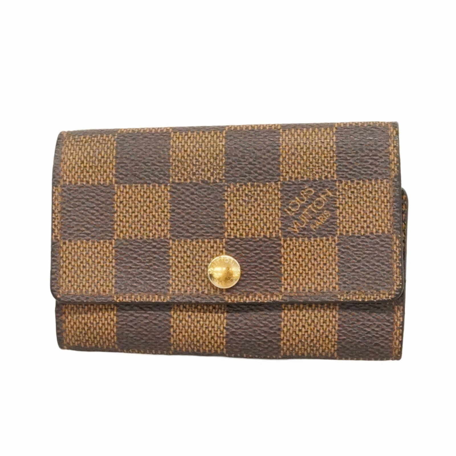 Keycase Louis Vuitton: Keycase Louis Vuitton A pre-owned Louis Vuitton Keycase in Ebene leather, perfect for adding a touch of luxury to your daily essentials. With its classic design and durable construction, this stylish