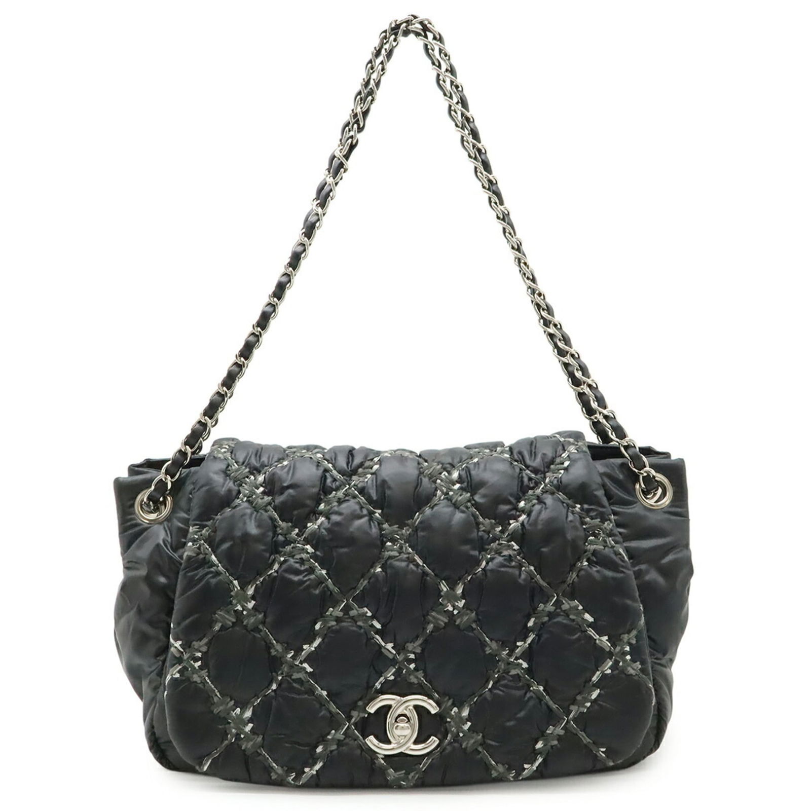 Chanel Shoulder Bag in Nylon: Chanel Shoulder Bag in Nylon A timeless Chanel shoulder bag in sleek nylon, this classic design is perfect for everyday wear. With its spacious interior and durable construction, it's ideal for carryi