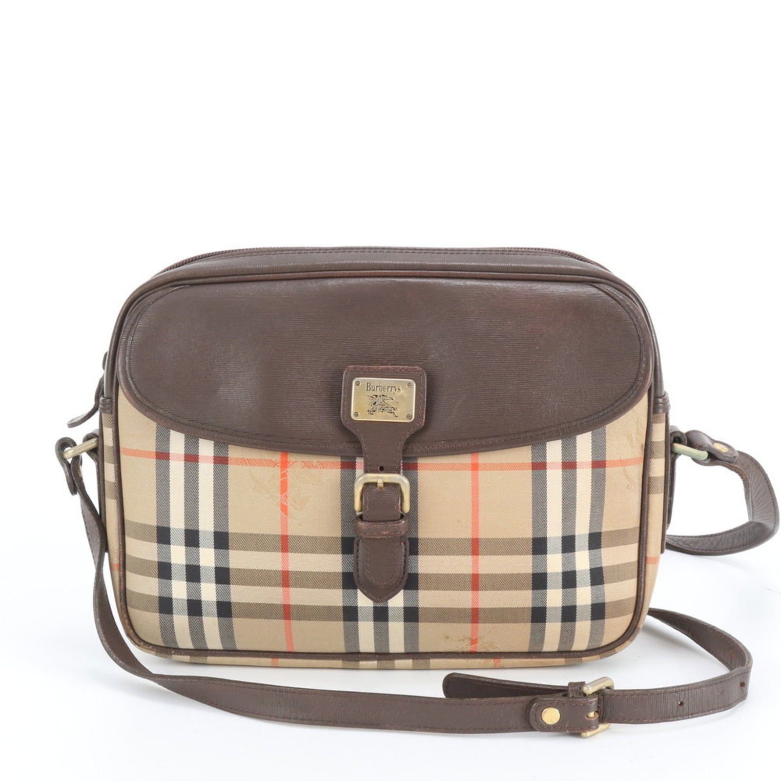 Burberry Canvas Leather Shoulder Bag: Burberry Canvas Leather Shoulder Bag A timeless Burberry shoulder bag, this brown leather and canvas tote boasts classic British style with a modern twist. With its spacious interior and adjustable st
