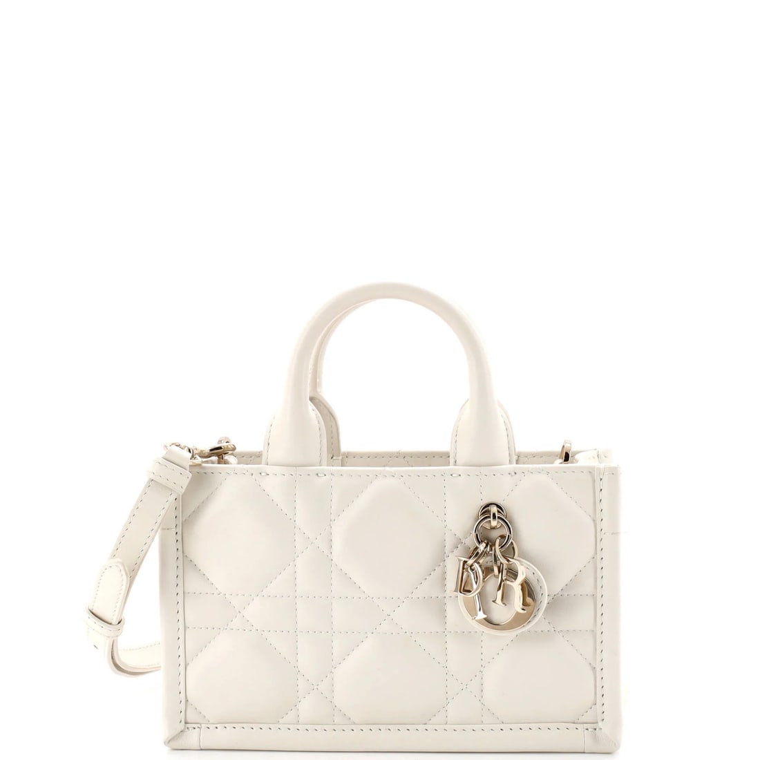 Mini Christian Dior Book Tote with Strap Macrocannage Quilt Calfskin: Mini Christian Dior Book Tote with Strap Macrocannage Quilt Calfskin Elevate your daily essentials with the Mini Christian Dior Book Tote, boasting sleek white leather exterior and neutral microfiber