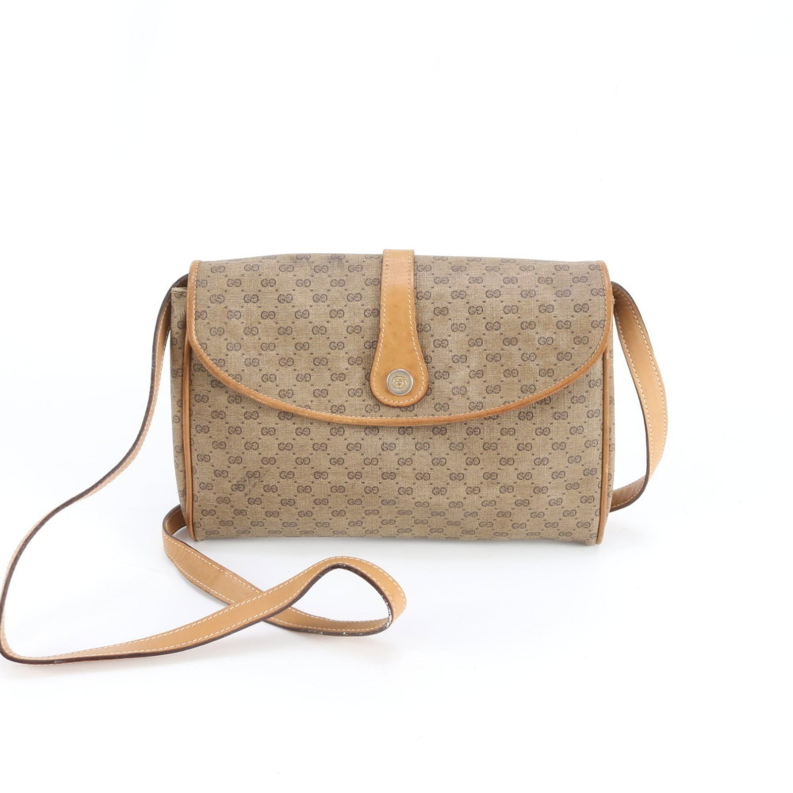 Gucci shoulder bag in leather and coated canvas: Gucci shoulder bag in leather and coated canvas A stylish Gucci shoulder bag in rich brown leather and coated canvas, perfect for adding a touch of luxury to your daily routine. With its spacious inte