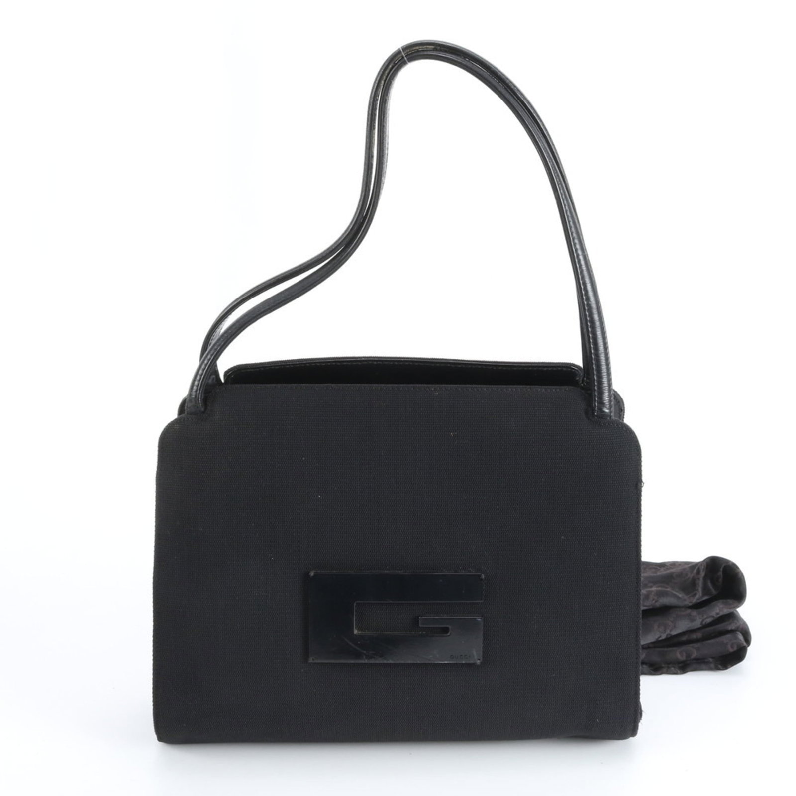 Gucci Tote Bag in Leather and Nylon: Gucci Tote Bag in Leather and Nylon A sleek and sophisticated Gucci tote bag, crafted from high-quality leather and durable nylon, boasts a timeless black color that exudes elegance. With its classic