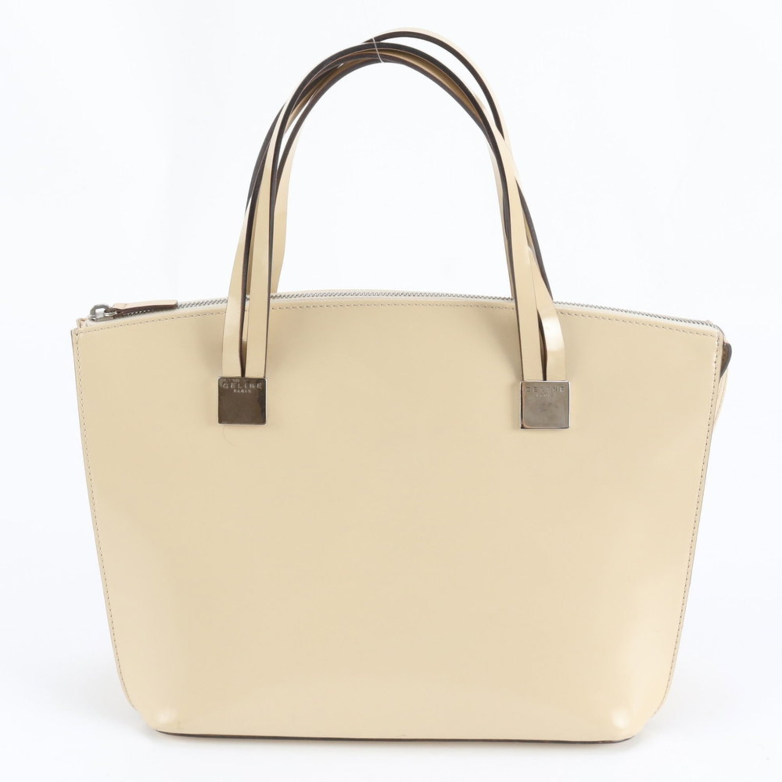 Celine Leather Tote Bag: Celine Leather Tote Bag A timeless beige leather tote from Celine, perfect for everyday use, boasts a spacious interior and sturdy 41cm handle for effortless carrying. With its classic design and high
