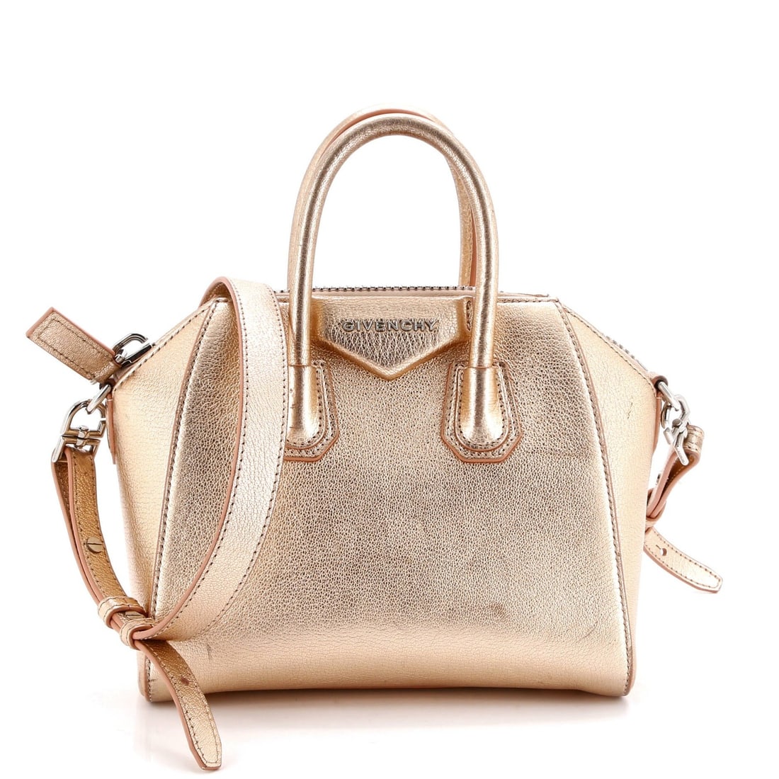 Givenchy Antigona Mini Leather Bag: Givenchy Antigona Mini Leather Bag The Givenchy Antigona Mini Leather Bag is a chic and sophisticated accessory that exudes luxury with its metallic exterior and neutral interior. Its compact size mak
