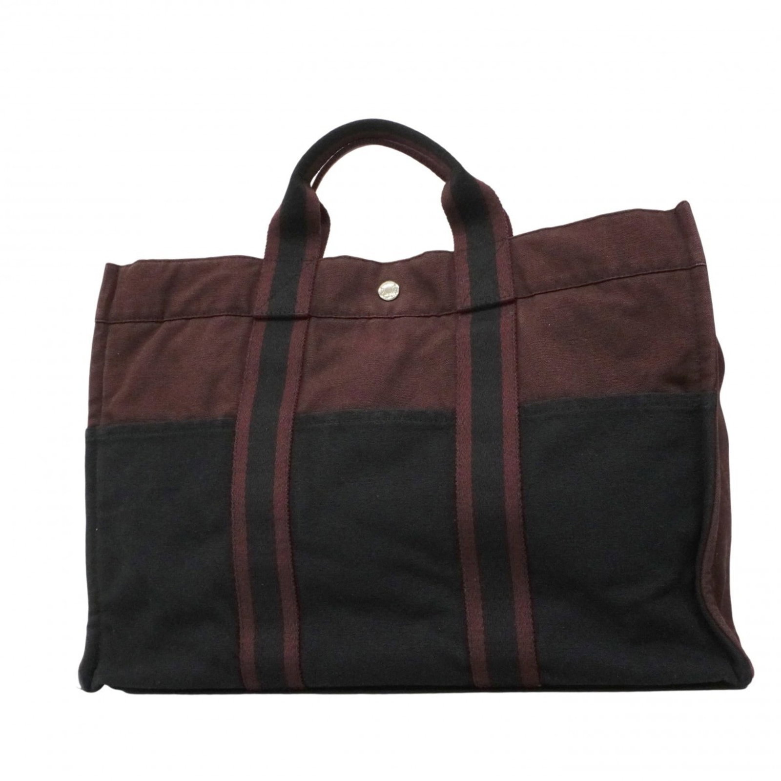 Hermes Canvas Tote Bag: Hermes Canvas Tote Bag A pre-owned Hermes canvas tote bag in sleek black and silver hardware, offering a timeless and sophisticated style that's perfect for everyday use. With its durable canvas const