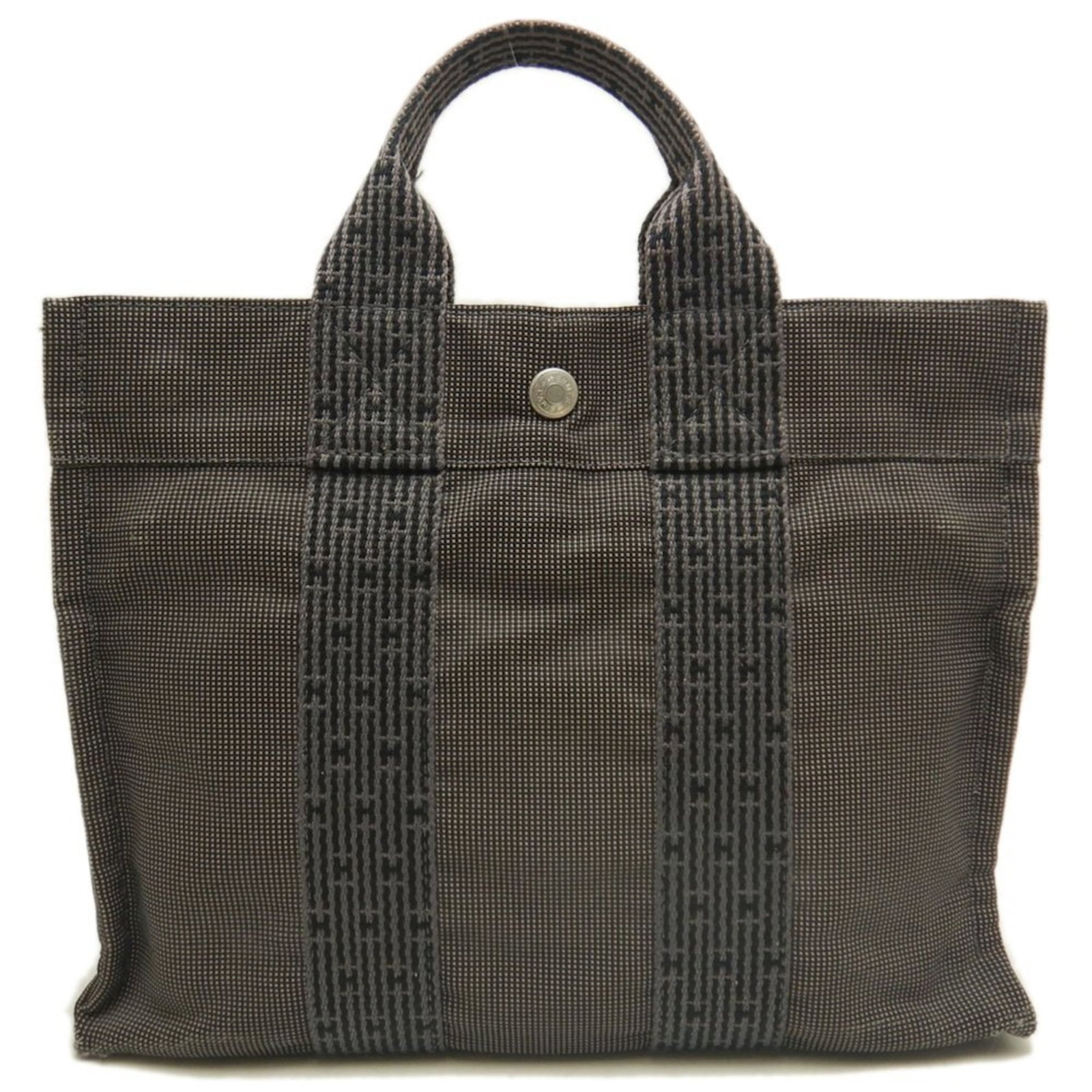 Hermes Tote Bag - Polyester: Hermes Tote Bag - Polyester A pre-owned Hermes tote bag in a versatile gray color, perfect for everyday use. Made from durable polyester, this classic design is both stylish and practical, with its ti