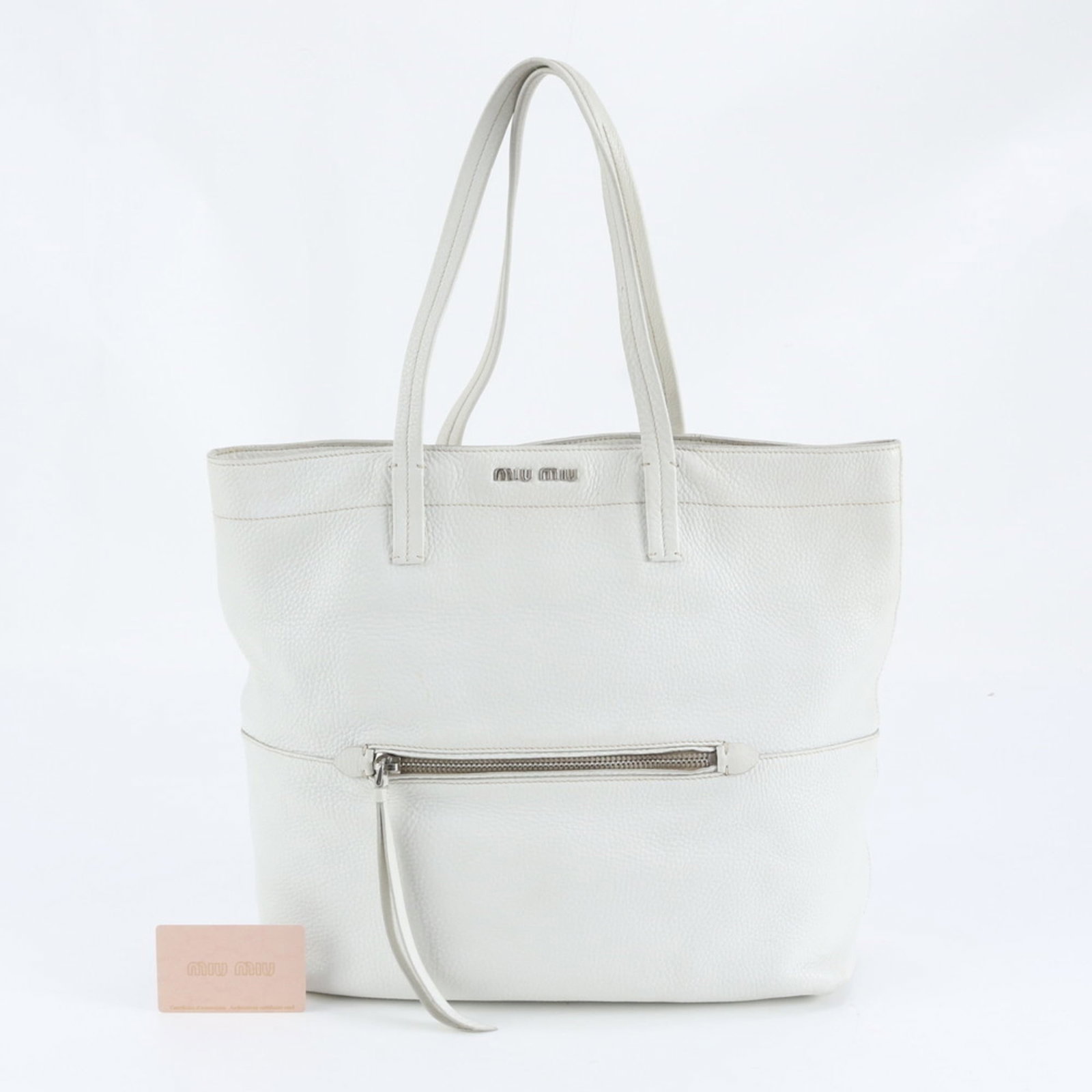 Miu Leather Tote Bag: Miu Leather Tote Bag Elevate your everyday style with the timeless Miu Miu leather tote bag, boasting sleek white leather and a classic design that exudes sophistication. Its spacious interior and adj