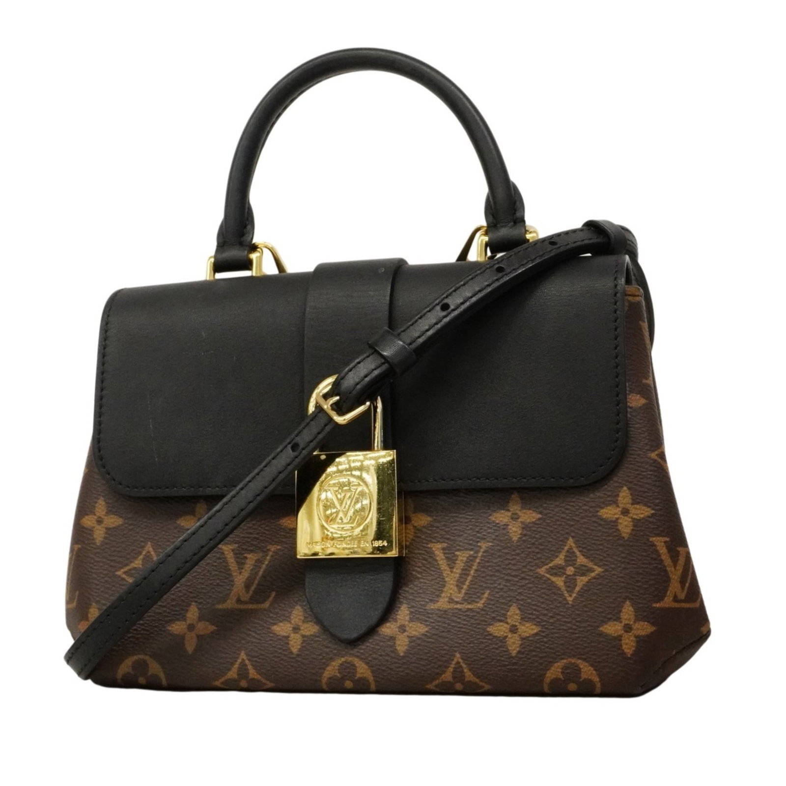 Handbag Louis Vuitton: Handbag Louis Vuitton A pre-owned Louis Vuitton handbag in rich brown and noir hues, this timeless piece boasts the iconic monogram pattern that has become synonymous with luxury. With its classic siz