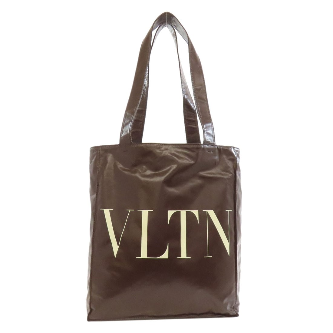 Calf VALENTINO logo Tote Bag: Calf VALENTINO logo Tote Bag Elevate your everyday style with this luxurious VALENTINO calf leather tote bag, crafted in Italy from rich brown calfskin. The timeless design and exceptional quality mak