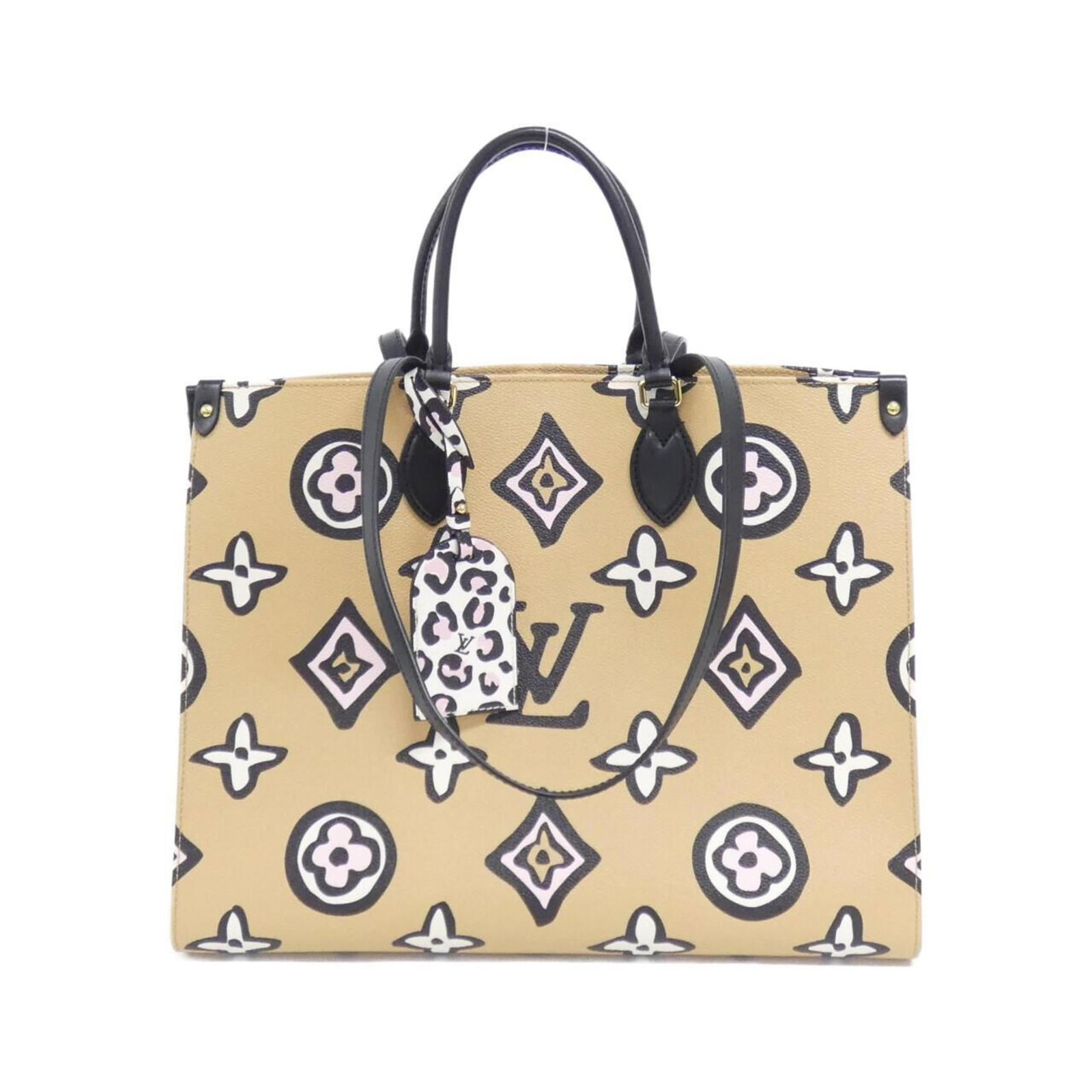 Louis Vuitton Coated Canvas Handbag: Louis Vuitton Coated Canvas Handbag A timeless piece from the iconic Louis Vuitton brand, this coated canvas handbag boasts a classic beige hue and elegant gold hardware, adding a touch of sophisticat
