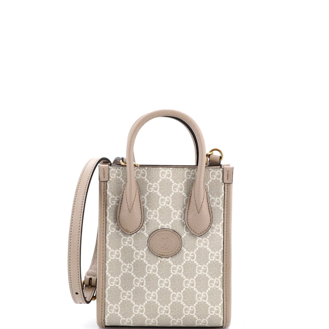 Gucci Interlocking G Patch Mini Tote in GG Coated Canvas: Gucci Interlocking G Patch Mini Tote in GG Coated Canvas Elevate your everyday with the iconic Gucci Interlocking G Patch Mini Tote, crafted from luxurious GG Coated Canvas and boasting a neutral exte