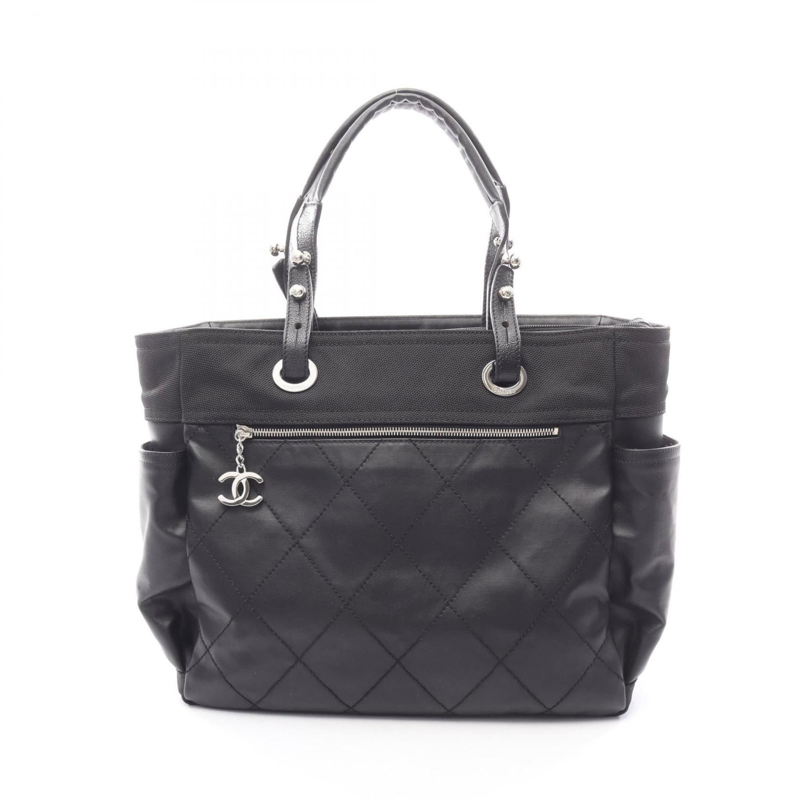 Chanel Tote Bag in Coated Canvas and Leather: Chanel Tote Bag in Coated Canvas and Leather A timeless and sophisticated Chanel tote bag, crafted from luxurious coated canvas and supple leather, in sleek black hue with elegant silver hardware. Wit