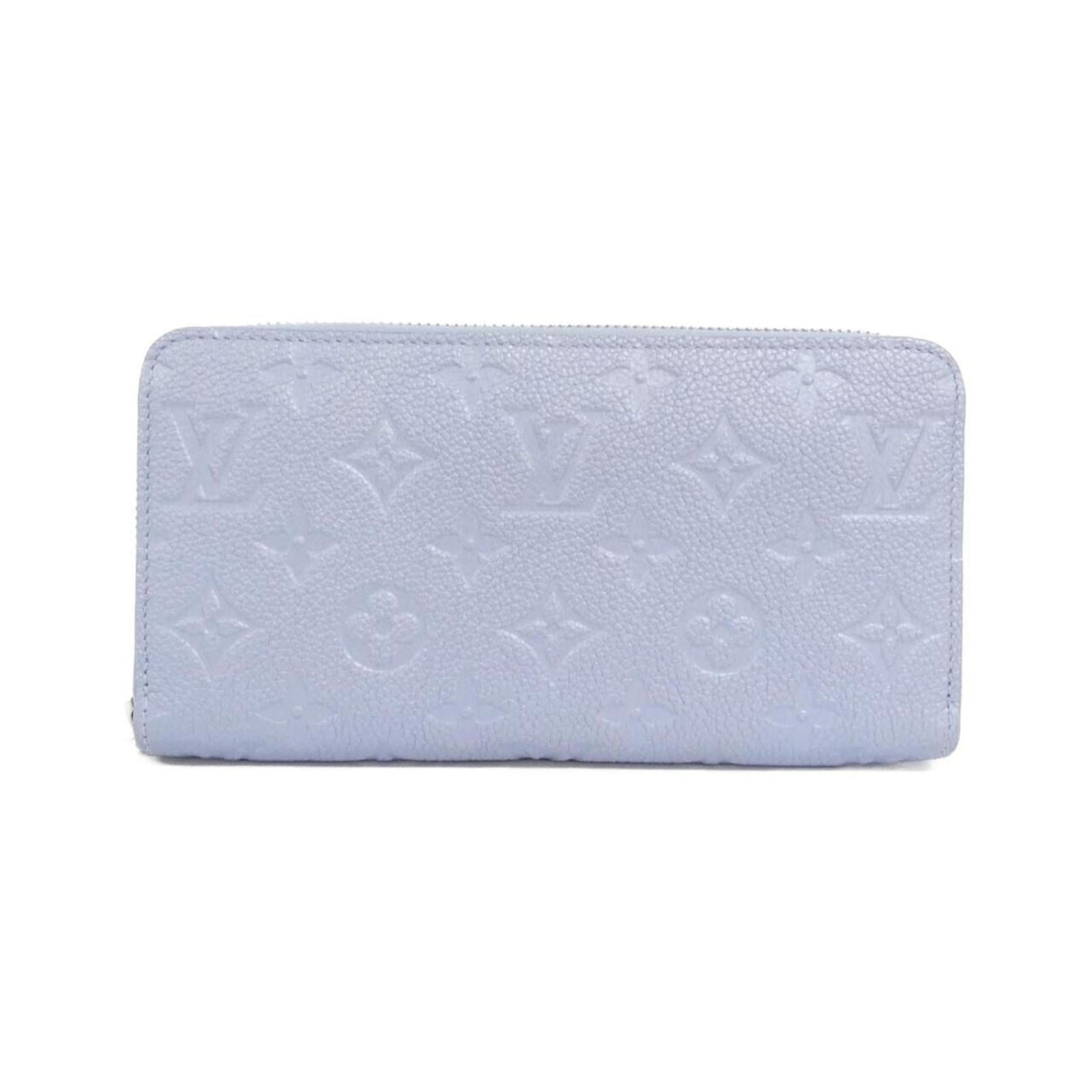 Louis Vuitton Monogram Empreinte Bi-Fold Wallet: Louis Vuitton Monogram Empreinte Bi-Fold Wallet A stunning Louis Vuitton Monogram Empreinte bi-fold wallet in a beautiful blue hue, boasting the iconic LV monogram pattern. With its classic design and