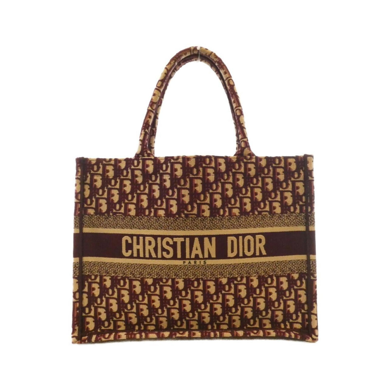 Christian Dior Canvas Handbag: Christian Dior Canvas Handbag A timeless piece from the iconic Christian Dior brand, this canvas handbag boasts a rich brown and burgundy color combination that exudes elegance and sophistication. Wit