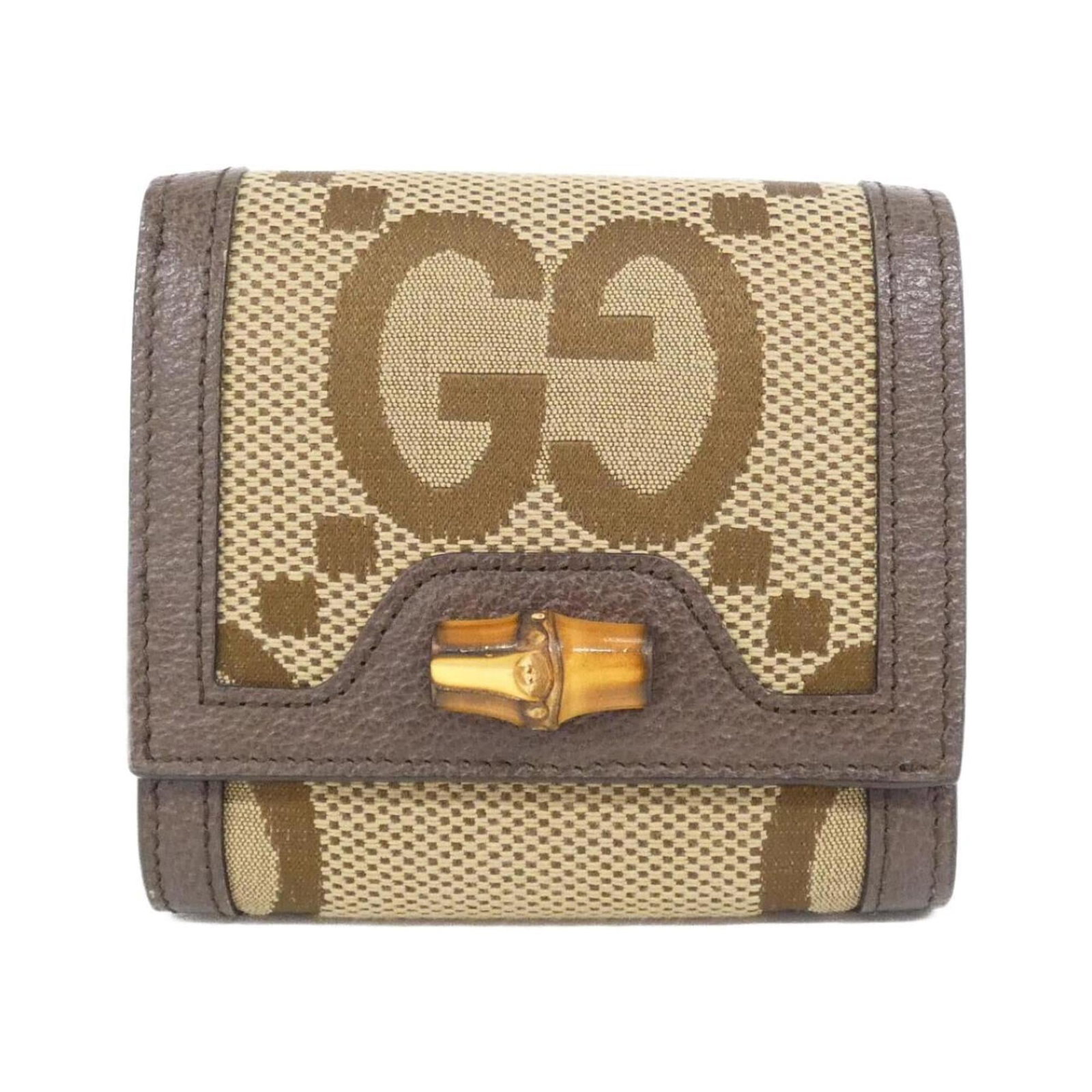 Gucci Bi-Fold Wallet in Gg Canvas and Leather: Gucci Bi-Fold Wallet in Gg Canvas and Leather Elevate your everyday style with the iconic Gucci bi-fold wallet, crafted from durable Gg Canvas and rich leather. This timeless piece boasts a classic de