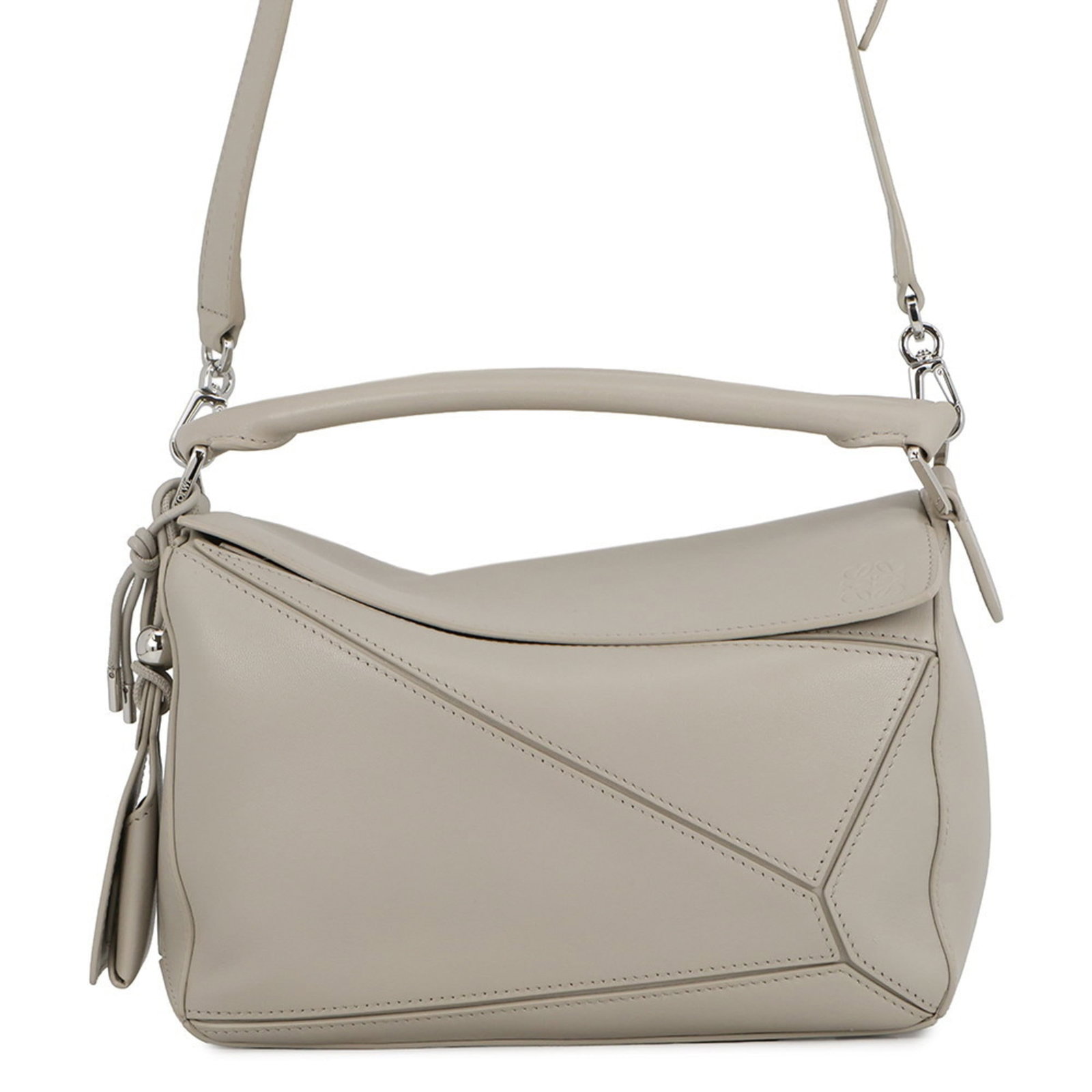 Loewe Shoulder Bag: Loewe Shoulder Bag Elevate your everyday style with the sleek and sophisticated Loewe shoulder bag, boasting a timeless gray hue and elegant silver hardware. This versatile tote boasts a spacious inte
