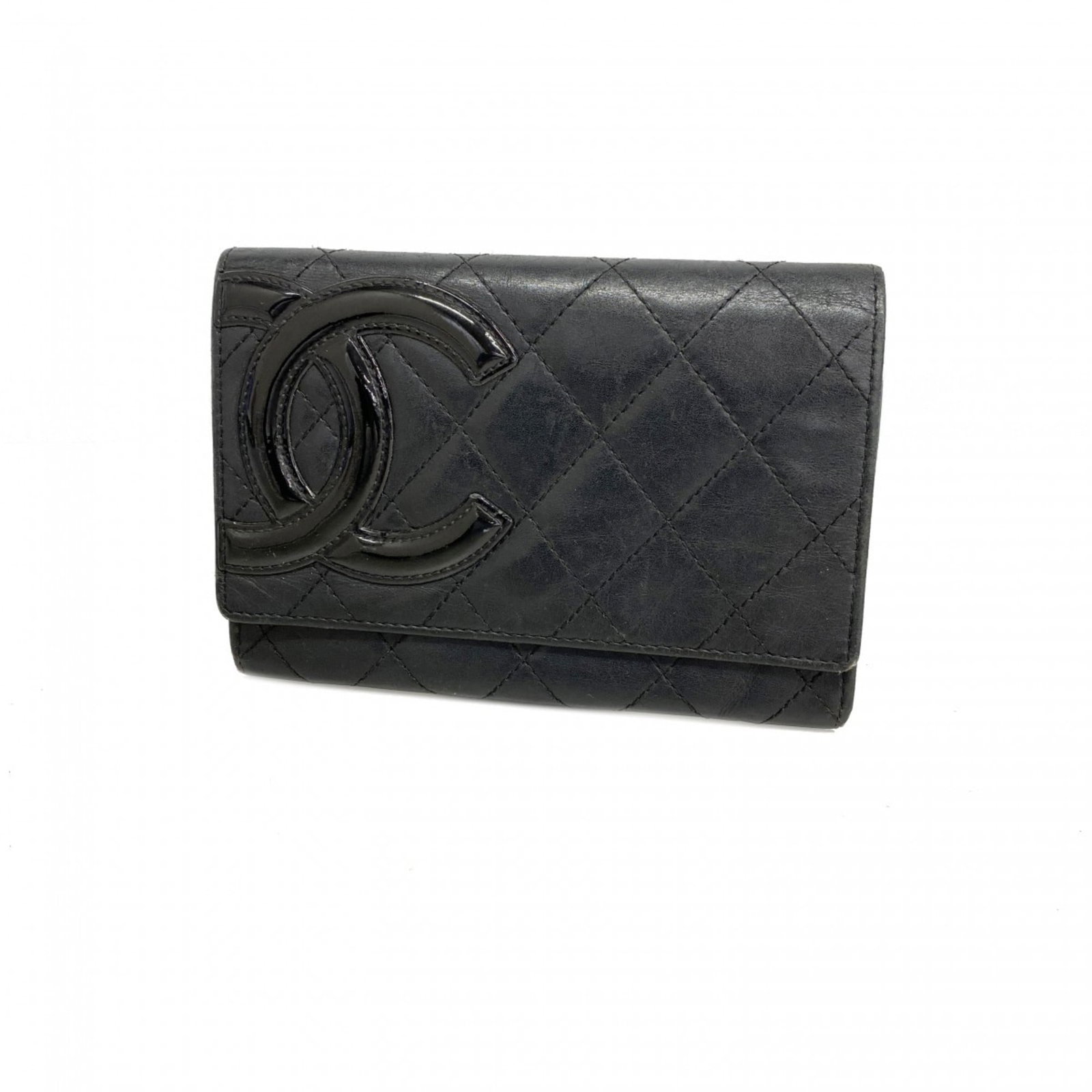 Chanel Bi-Fold Leather Wallet: Chanel Bi-Fold Leather Wallet A timeless Chanel bi-fold leather wallet in sleek black lambskin, perfect for adding a touch of sophisticated elegance to your daily essentials. With its classic design a