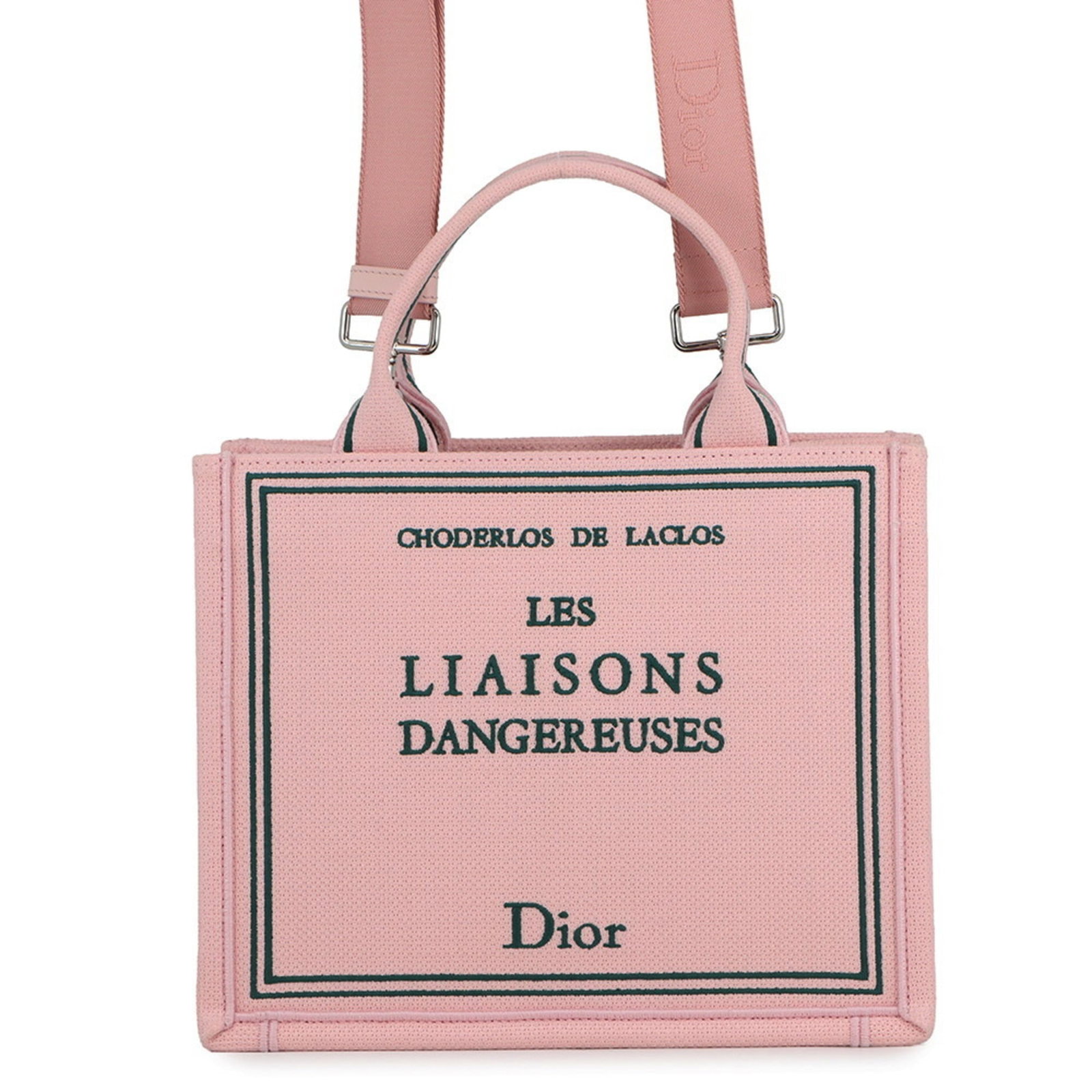 Christian Dior Canvas Handbag: Christian Dior Canvas Handbag A stunning canvas handbag from Christian Dior, boasting a chic pink hue and sleek silver hardware, adds a touch of timeless elegance to any outfit. With its spacious