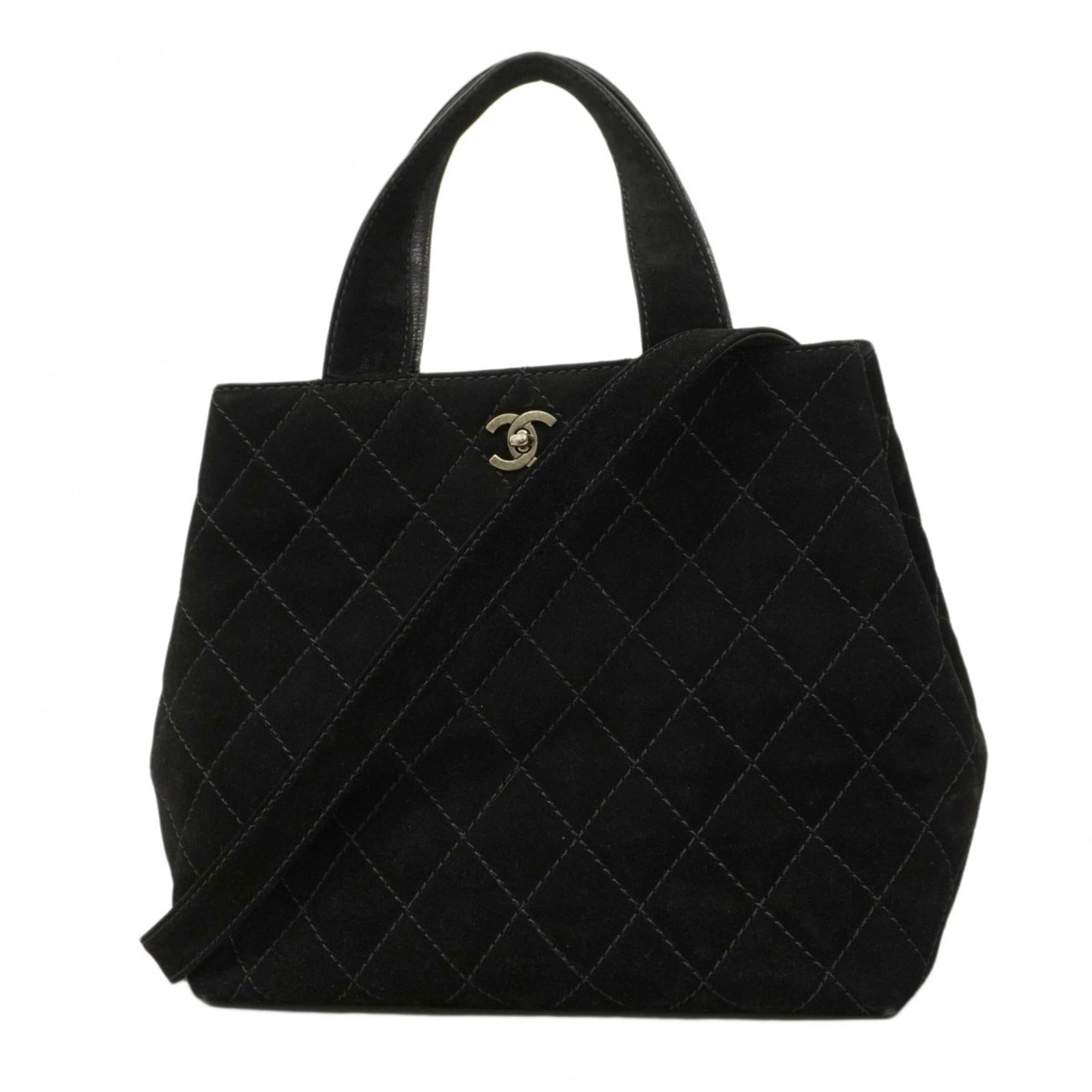 Suede Chanel Handbag: Suede Chanel Handbag A sleek and sophisticated Chanel suede handbag, this timeless piece boasts classic design elements with a luxurious touch of soft black suede. With its silver hardware accents and