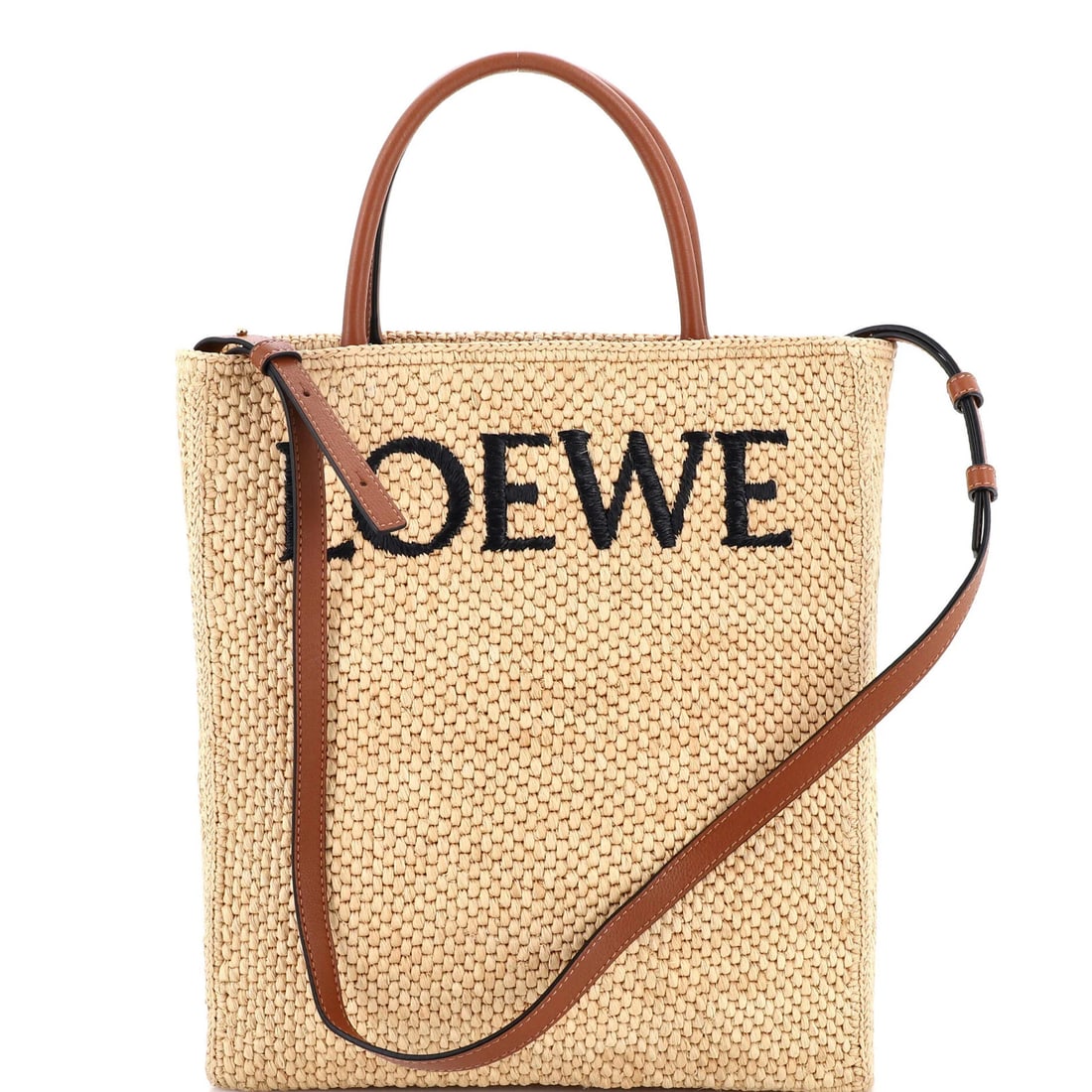 South Loewe A4 Tote Raffia and Leather North: South Loewe A4 Tote Raffia and Leather North The South Loewe A4 Tote is a timeless, neutral-toned accessory that exudes understated elegance. Crafted from high-quality raffia and leather, this spaciou