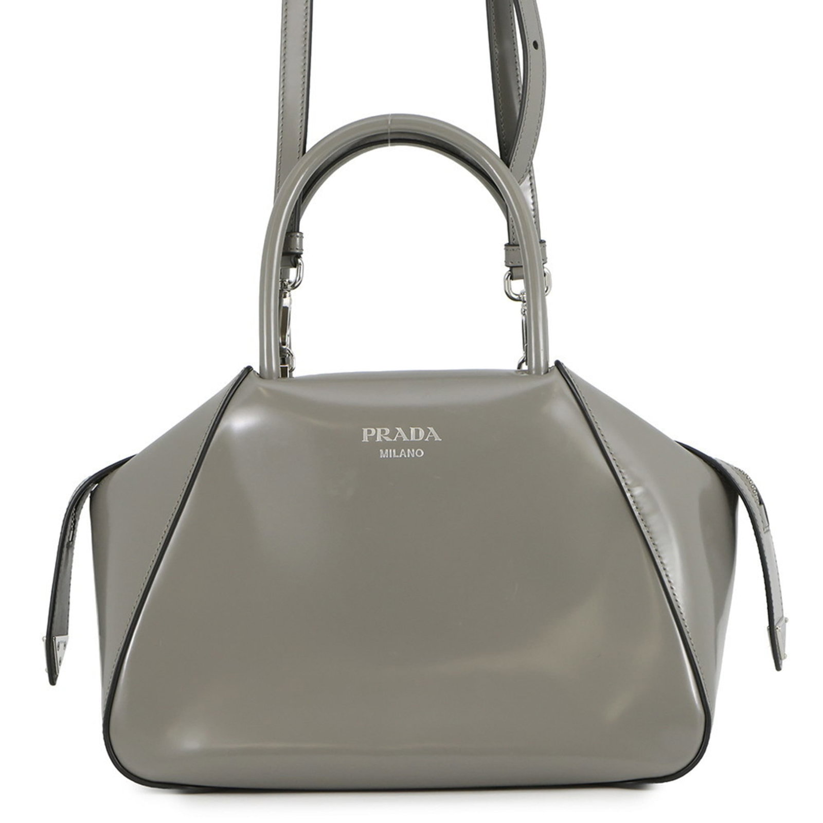 Prada Leather Shoulder Bag: Prada Leather Shoulder Bag A timeless and sophisticated Prada leather shoulder bag, crafted from high-quality gray leather with sleek silver hardware, adds a touch of elegance to any outfit. With its