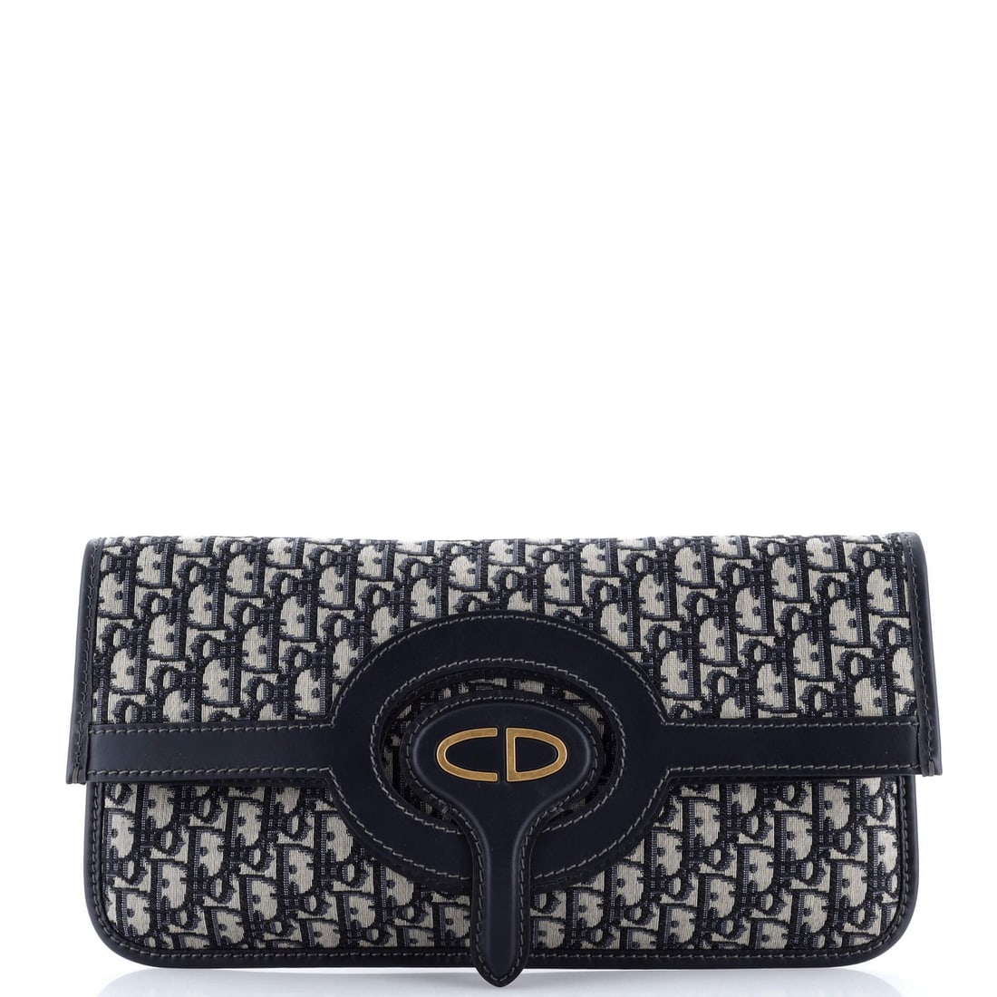 Christian Dior Fold Over Clutch in Oblique Canvas: Christian Dior Fold Over Clutch in Oblique Canvas Elevate your evening look with the iconic Christian Dior Fold Over Clutch in Oblique Canvas, boasting a sleek blue exterior and neutral interior. This