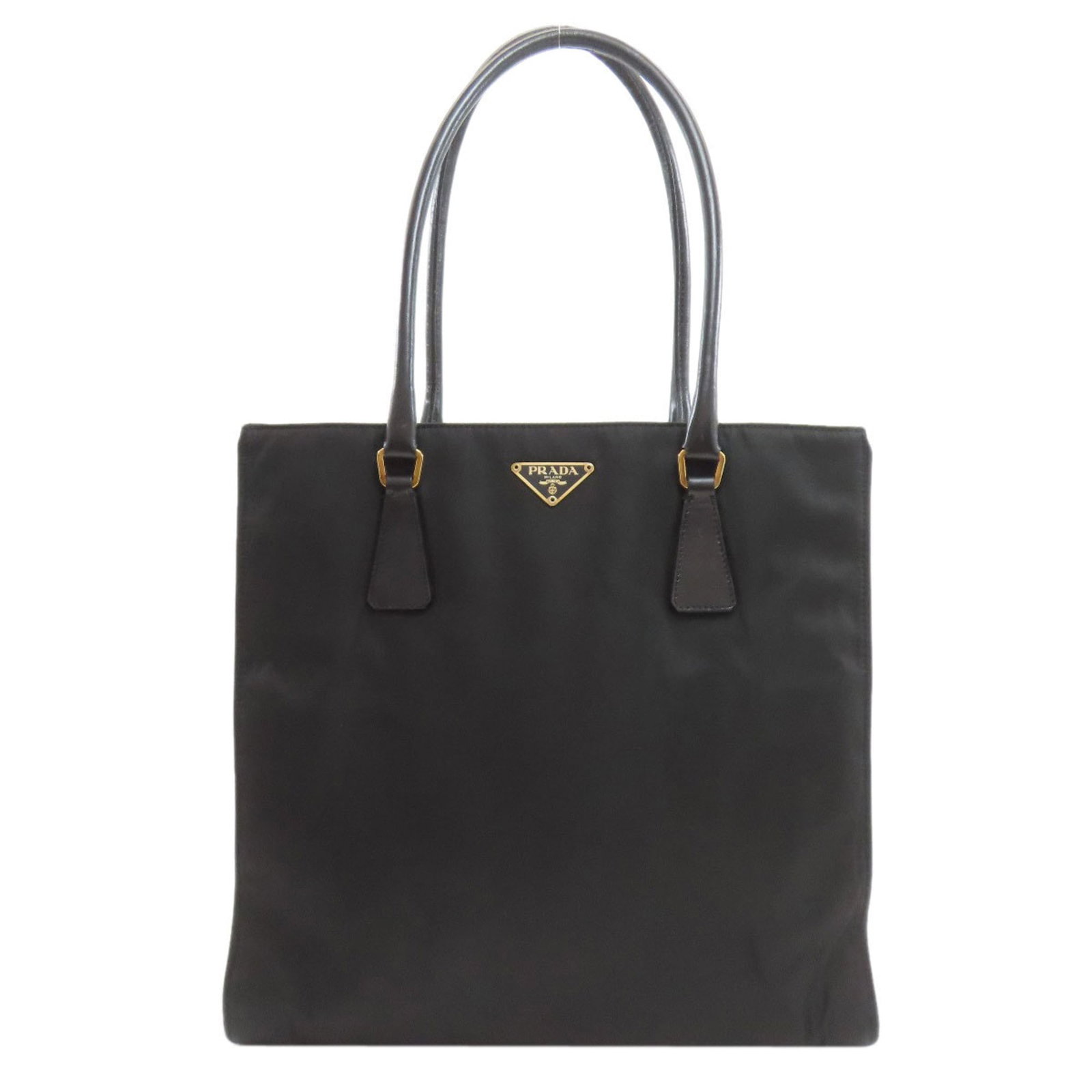 Nylon Prada Tote Bag: Nylon Prada Tote Bag A sleek and sophisticated Prada tote in black nylon, featuring a spacious interior with a zippered pocket for added security, and a sturdy handle that makes it easy to carry. With