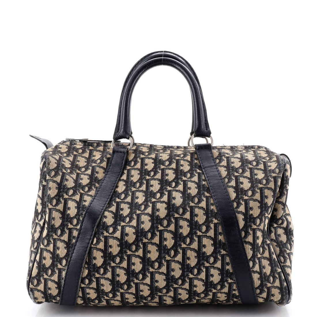 Christian Dior Vintage Boston Bag in Diorissimo Canvas Medium: Christian Dior Vintage Boston Bag in Diorissimo Canvas Medium A rare and iconic piece from Christian Dior's vintage collection, the Boston Bag in Diorissimo canvas boasts a striking blue hue that exud