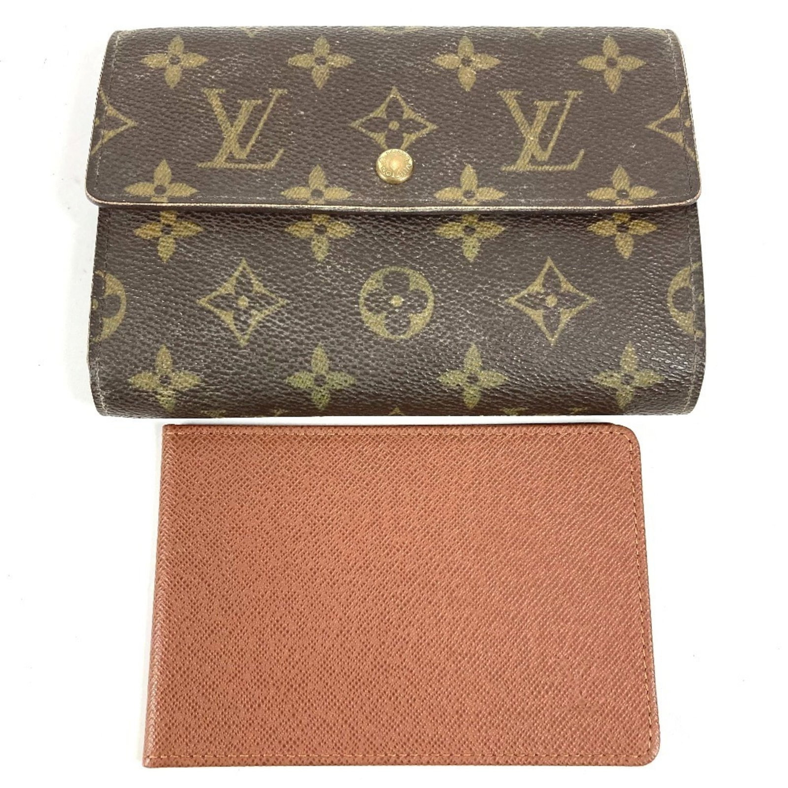 Louis Vuitton Tri-Fold Monogram Wallet: Louis Vuitton Tri-Fold Monogram Wallet A timeless piece from the iconic Louis Vuitton brand, this tri-fold wallet boasts the signature monogram pattern in rich brown tones. With its classic design and