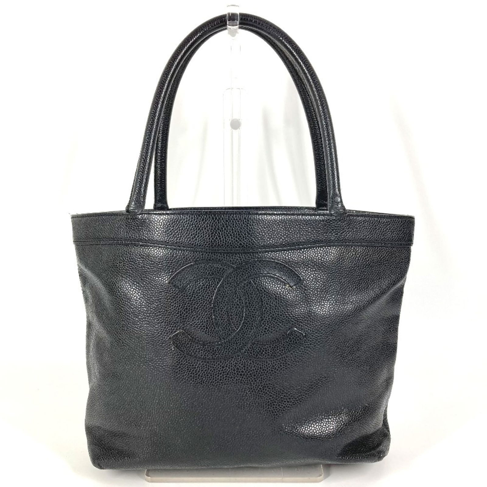 Chanel Tote Bag in Grained Calfskin: Chanel Tote Bag in Grained Calfskin A timeless and sophisticated Chanel tote bag in rich, grained calfskin, perfect for adding an air of effortless elegance to any outfit. With its classic design and