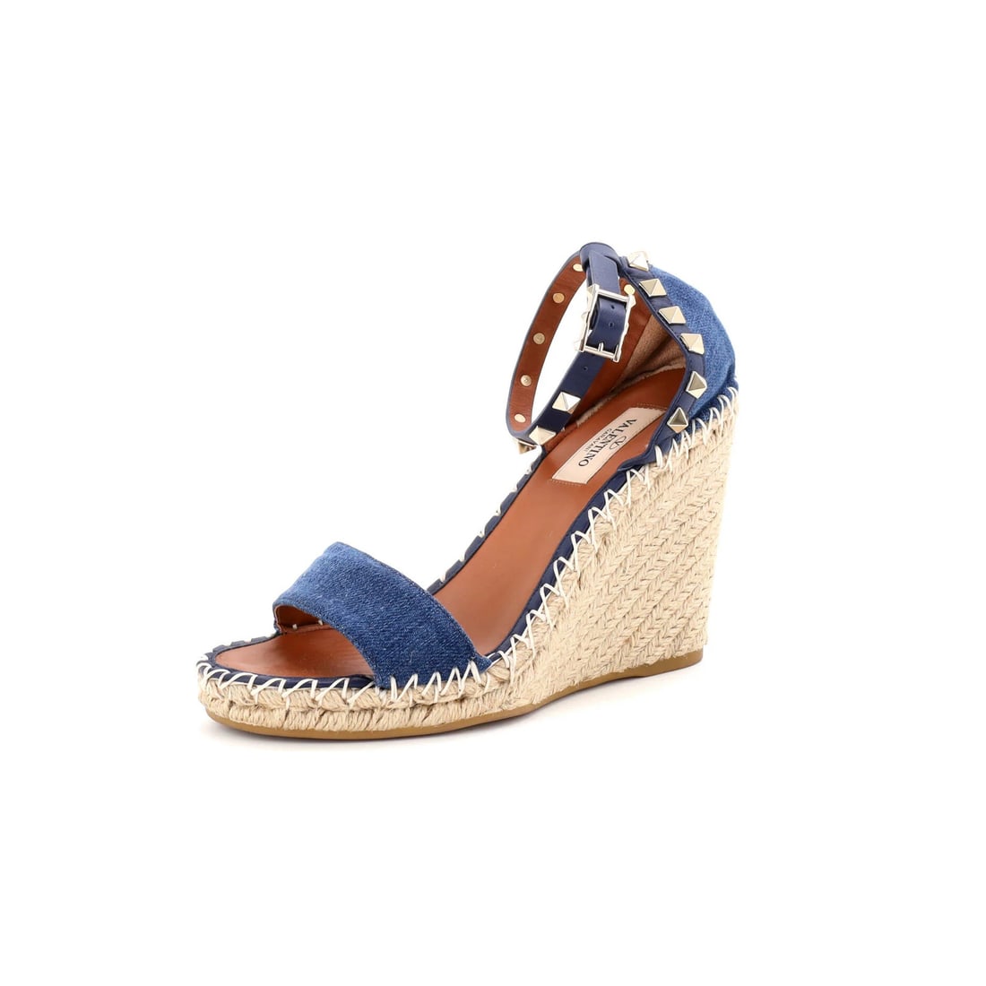 Valentino Garavani Rockstud Wedge Espadrille Sandals in Denim: Valentino Garavani Rockstud Wedge Espadrille Sandals in Denim Elevate your summer style with these stunning Valentino Garavani Rockstud Wedge Espadrille Sandals in denim blue. The iconic Rockstud desi