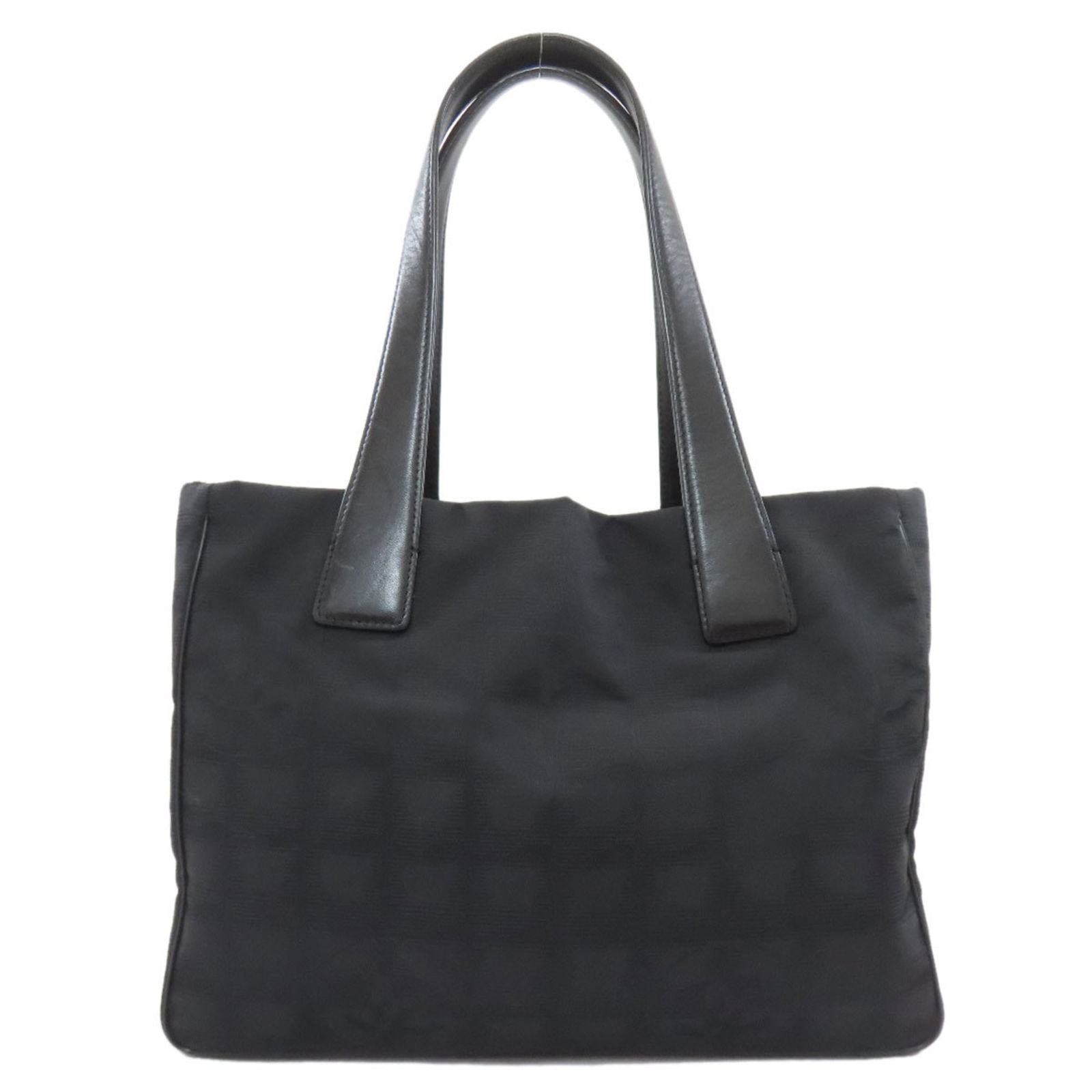 Chanel Tote Bag in Nylon with Jacquard: Chanel Tote Bag in Nylon with Jacquard A chic and timeless piece, this Chanel tote bag in black nylon with intricate Jacquard details is a must-have for any fashion enthusiast. With its classic design