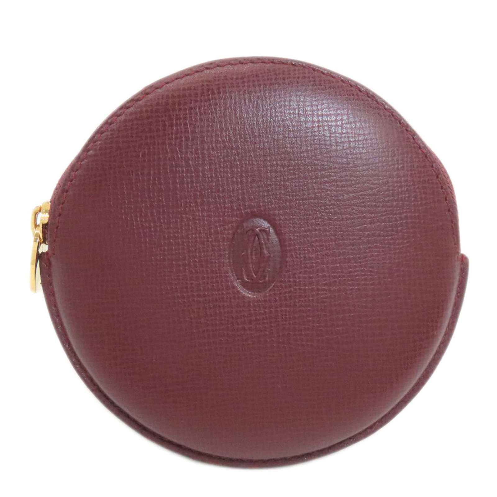 Cartier Must Line Coin Case in Women's Leather: Cartier Must Line Coin Case in Women's Leather A stunning Cartier Must Line Coin Case in rich Bordeaux leather, this elegant accessory is perfect for adding a touch of sophistication to any outfit. It