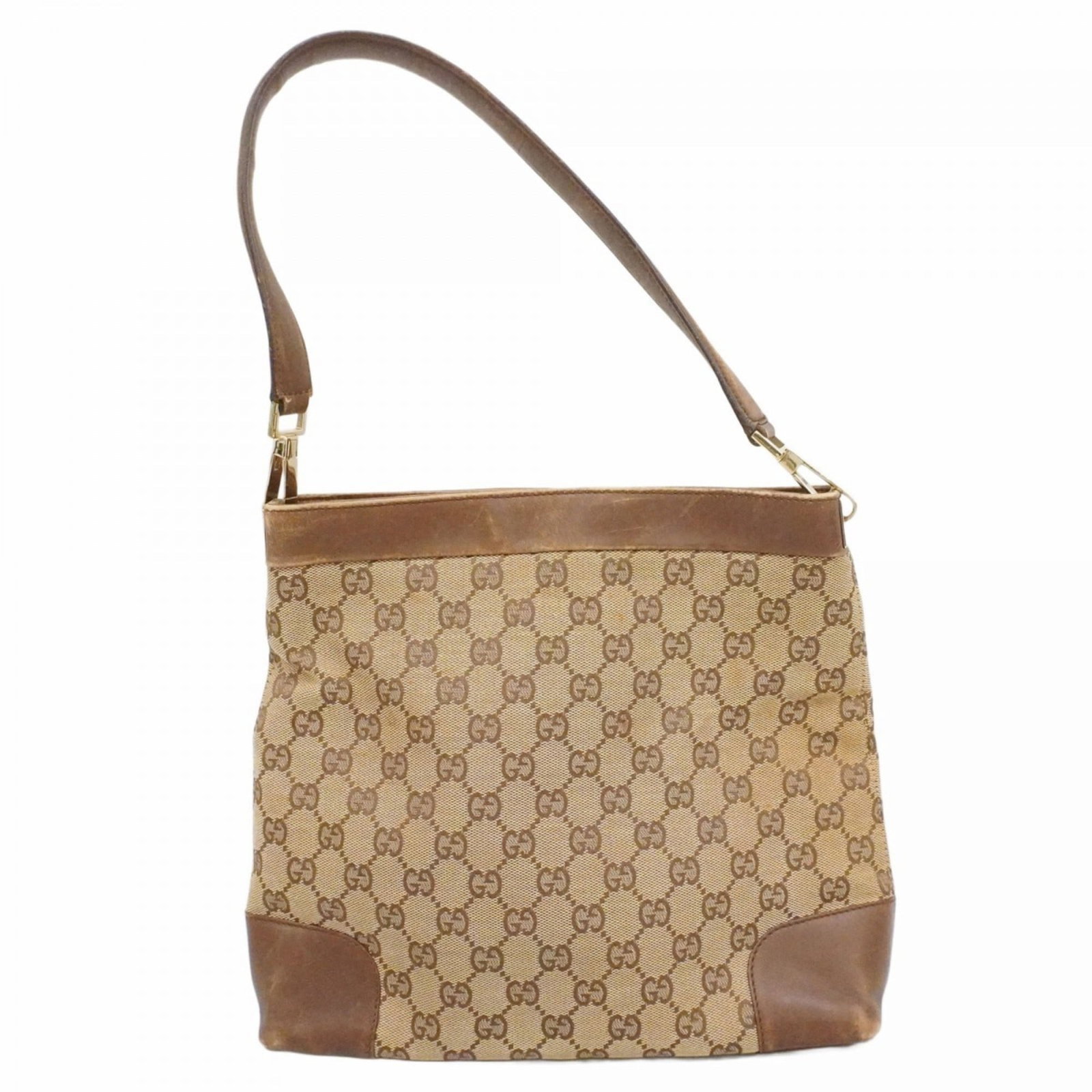 Gucci Canvas Shoulder Bag: Gucci Canvas Shoulder Bag A stylish and versatile Gucci canvas shoulder bag, perfect for everyday use, boasts a timeless brown color and elegant champagne gold hardware. With its classic design and sp