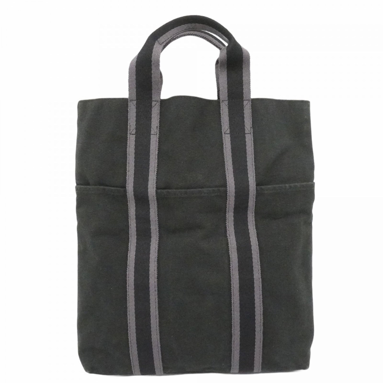 Hermes Canvas Tote Bag: Hermes Canvas Tote Bag A sleek and timeless black canvas tote from the iconic French brand Hermes, boasting classic silver hardware and a sturdy 36cm design that's perfect for daily errands or a night