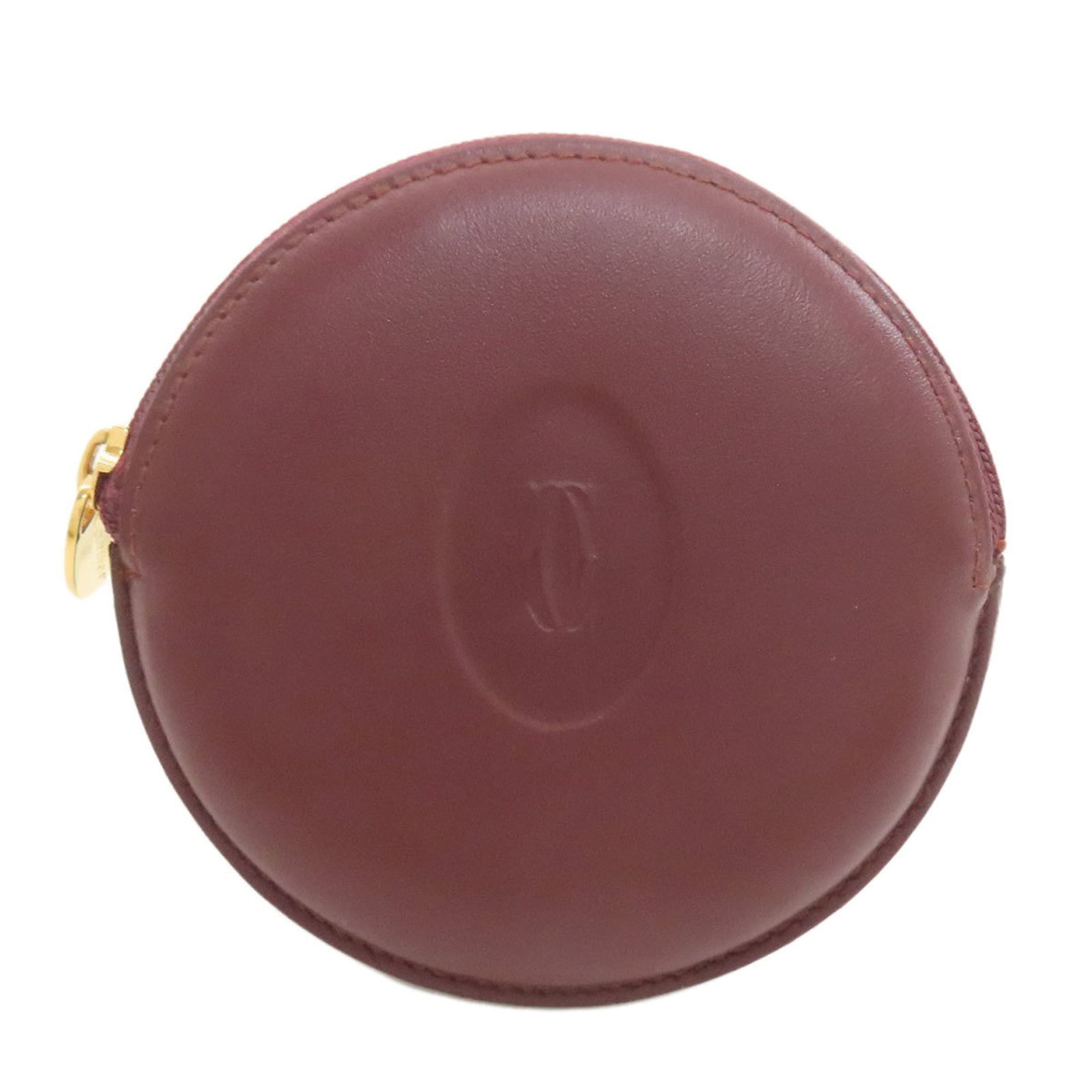 Cartier Must Line Coin Case in Women's Leather: Cartier Must Line Coin Case in Women's Leather A Cartier Must Line Coin Case in rich Bordeaux leather, this elegant accessory is perfect for adding a touch of sophistication to any outfit. With its cl